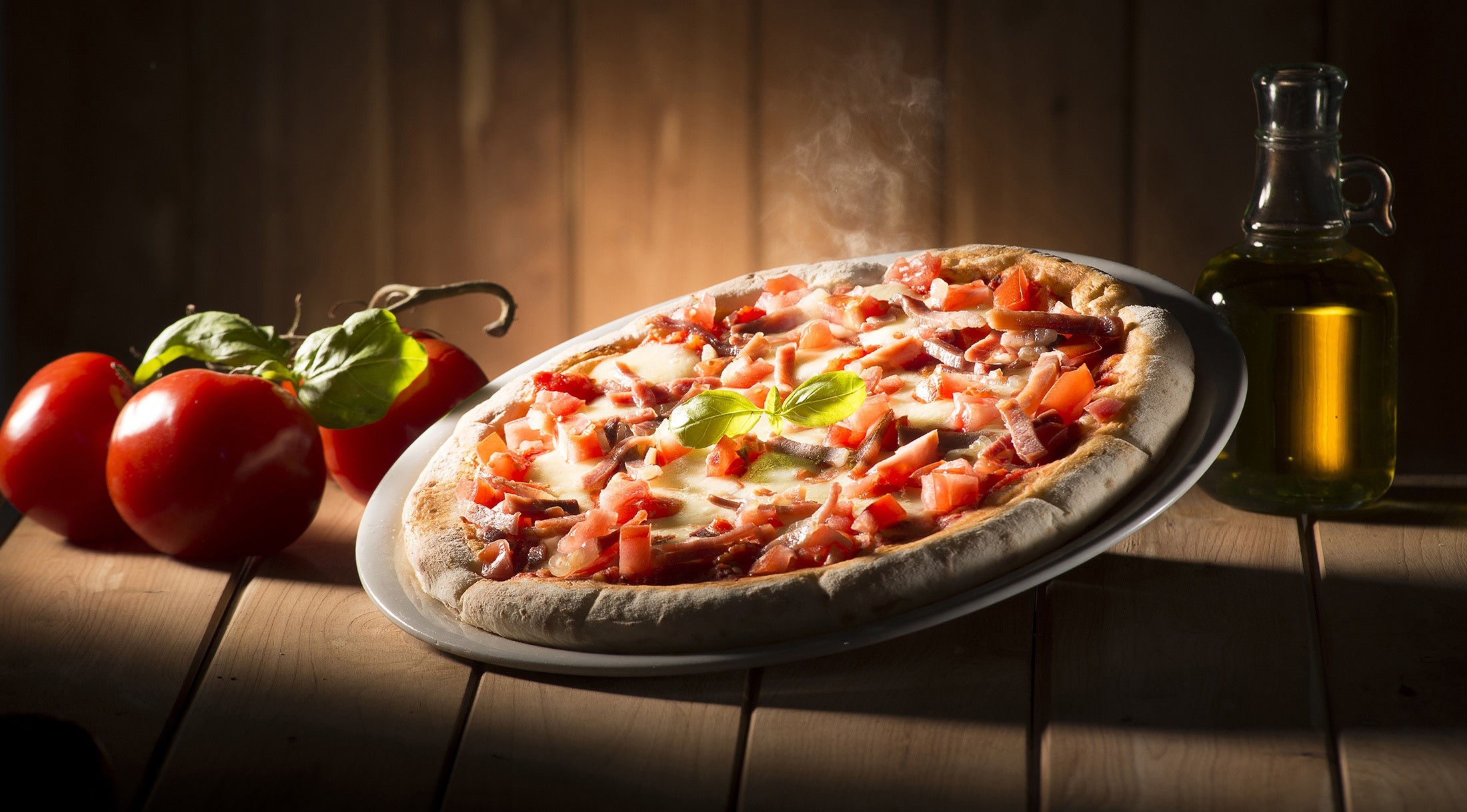 Hot pizza with tomatoes, basil, and olive oil HD Wallpaper