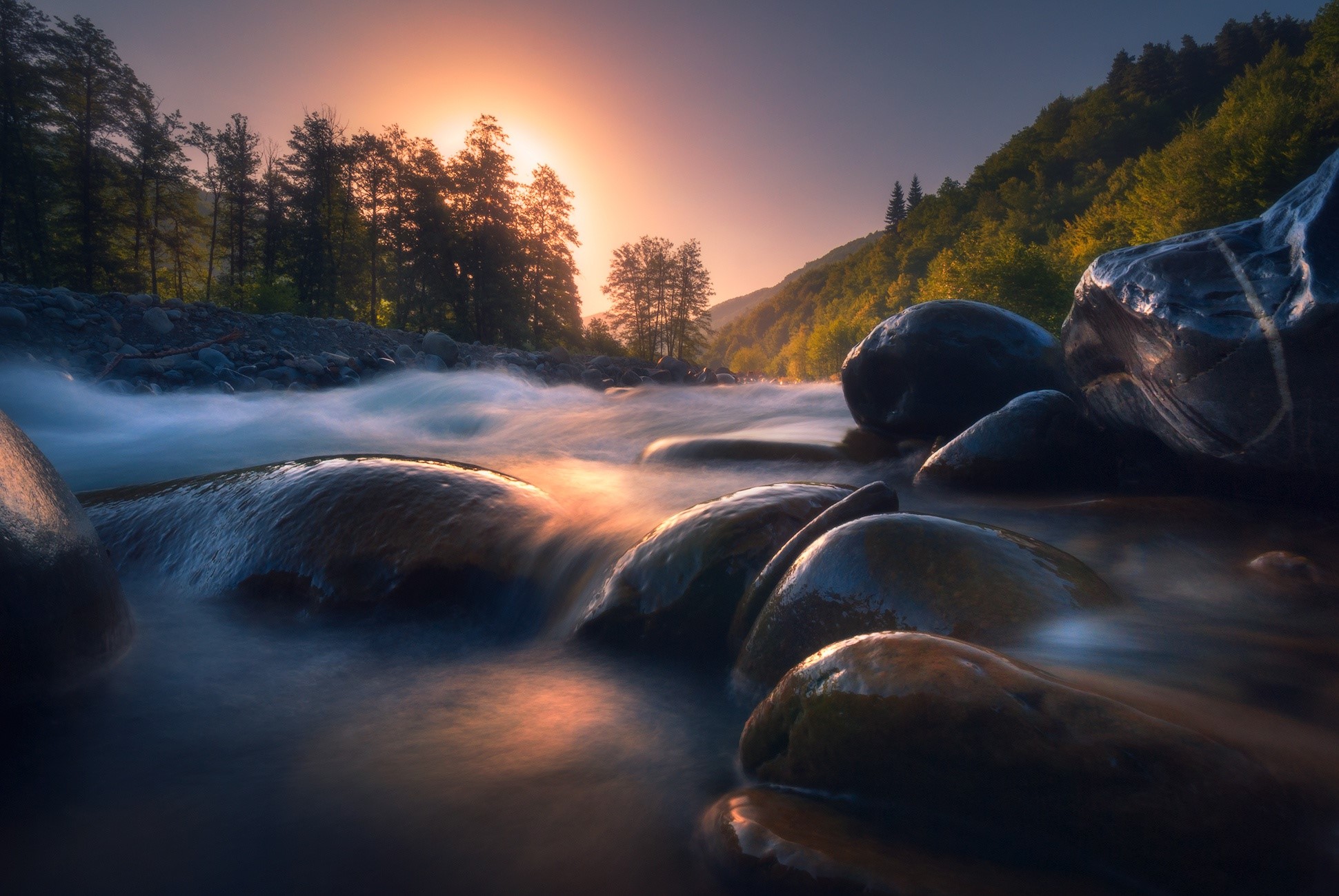 River flowing over stones at sunset HD Wallpaper