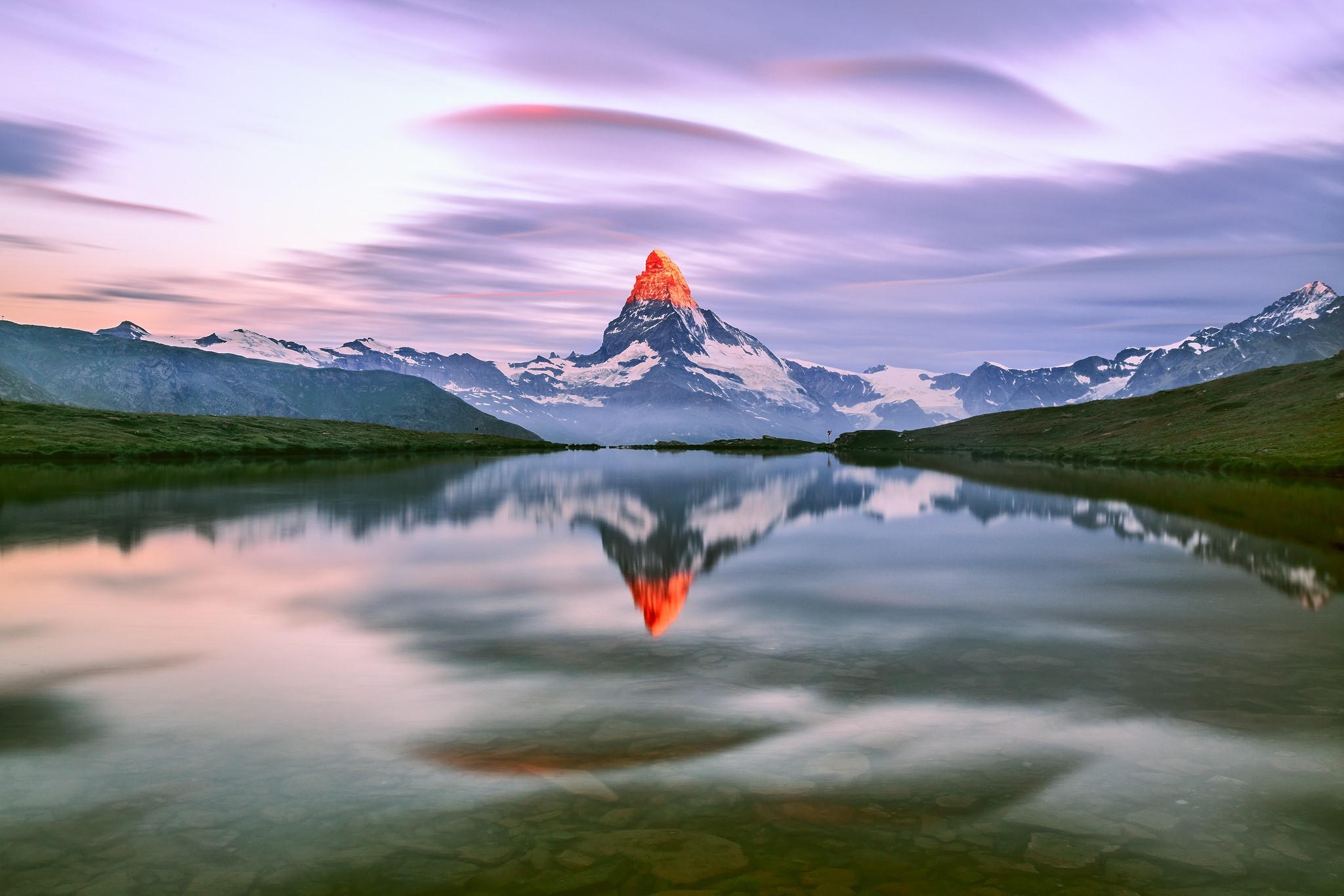 Matterhorn mountain reflected in a lake at sunrise HD Wallpaper