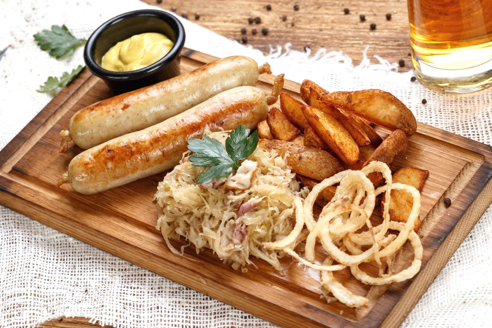 Sausages with Sauerkraut, Potato Wedges, and Mustard HD Wallpaper