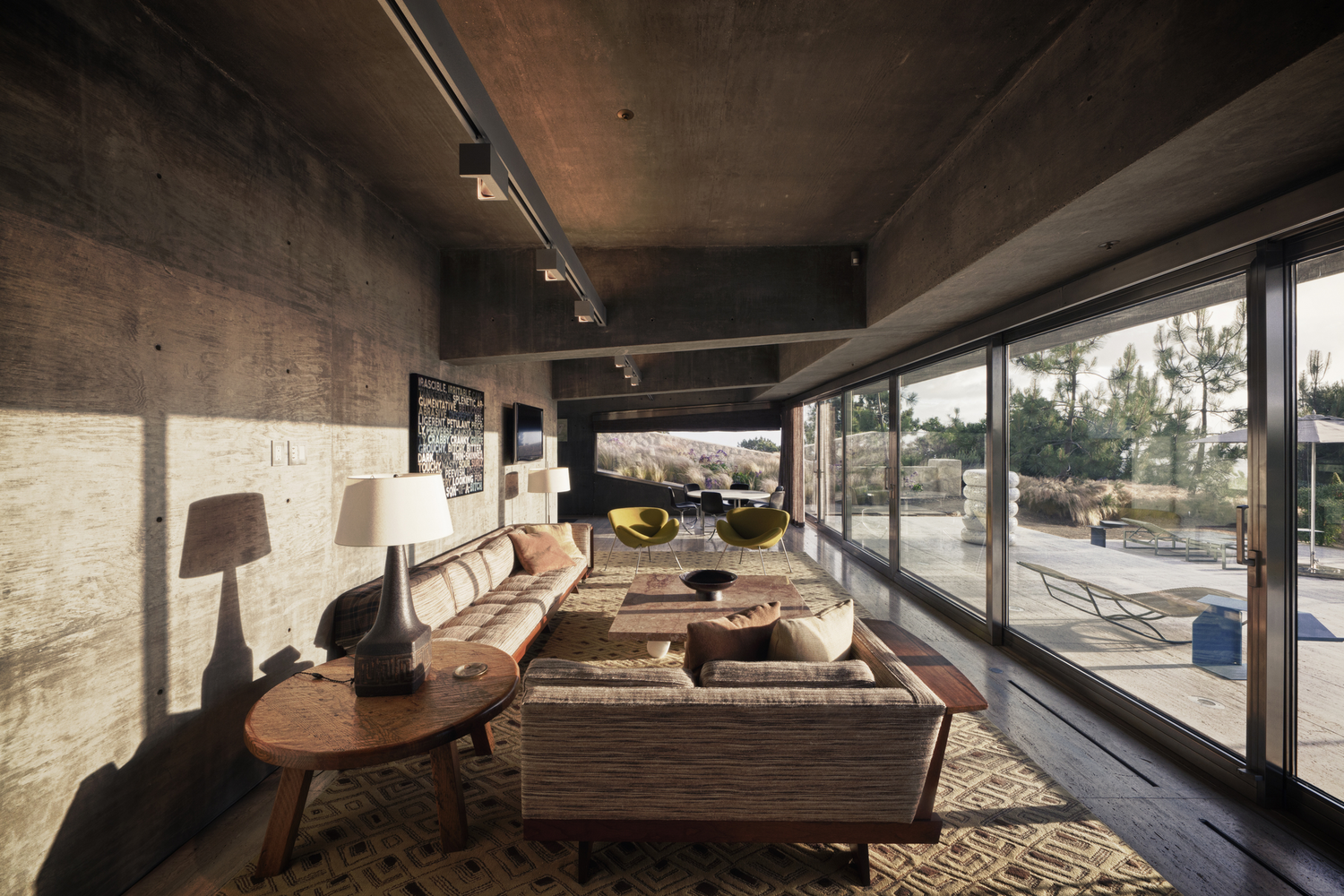 Modern living room with concrete walls and large windows HD Wallpaper