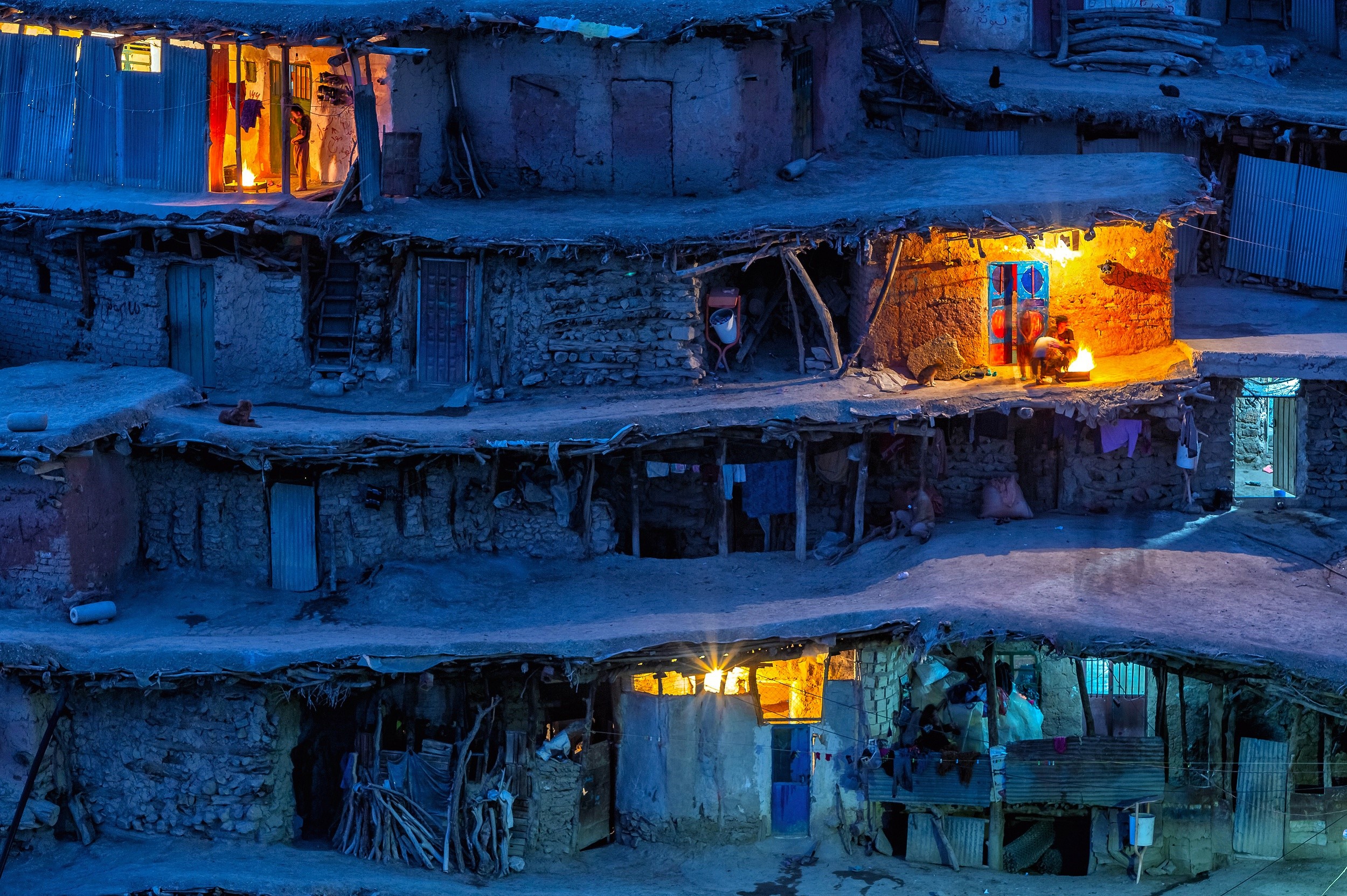 People in a village in Iran at night with lights HD Wallpaper