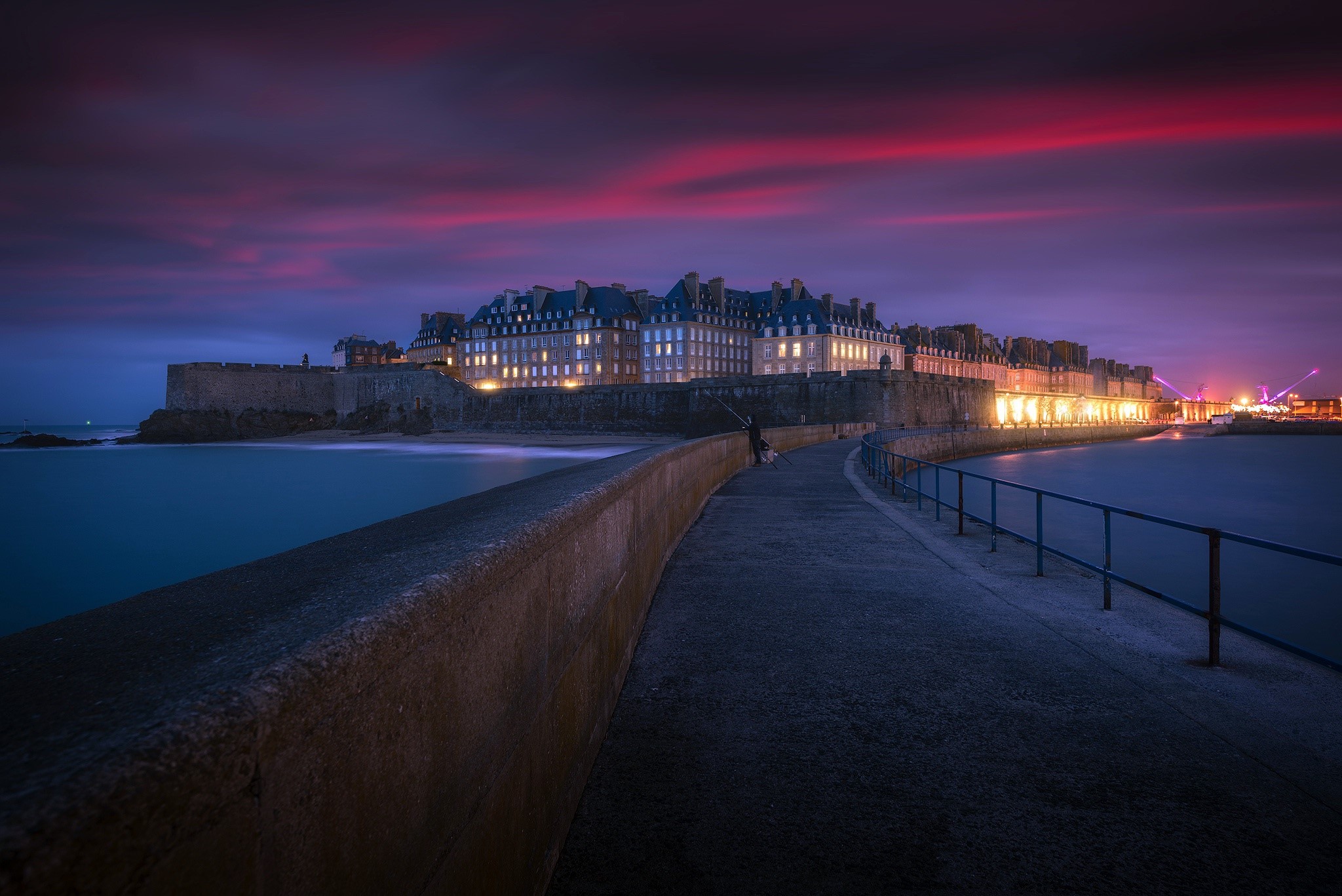 Saint-Malo ramparts at dusk with dramatic sky HD Wallpaper