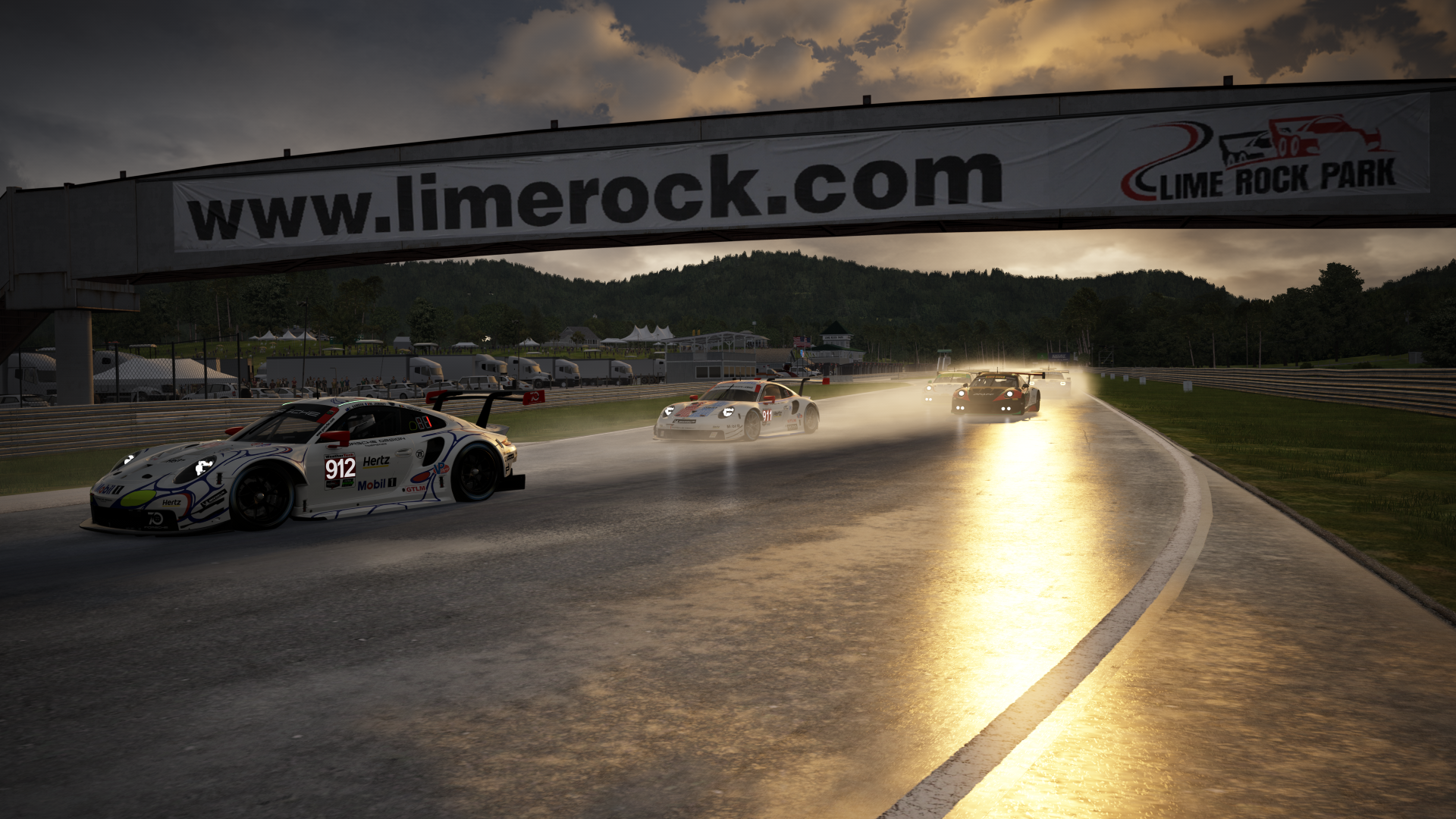 Race cars on wet track at Lime Rock Park HD Wallpaper
