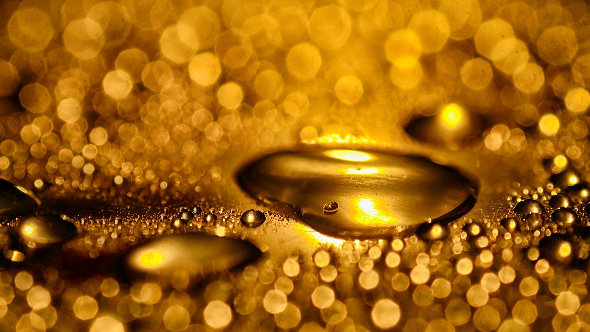 Abstract macro view of golden water drops with bokeh effect HD Wallpaper