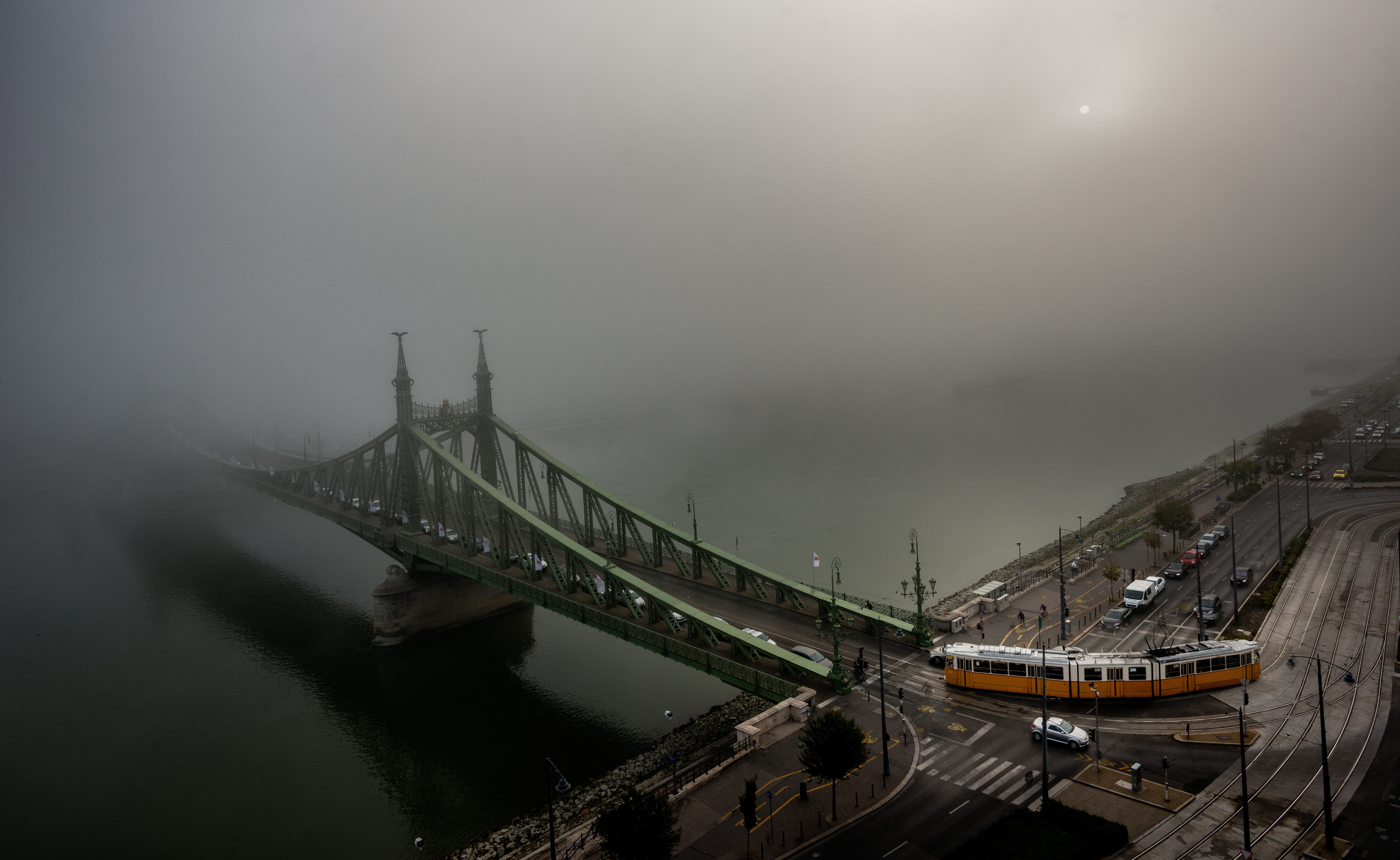 4K aerial view of Liberty Bridge in Budapest, Hungary during foggy weather HD Wallpaper