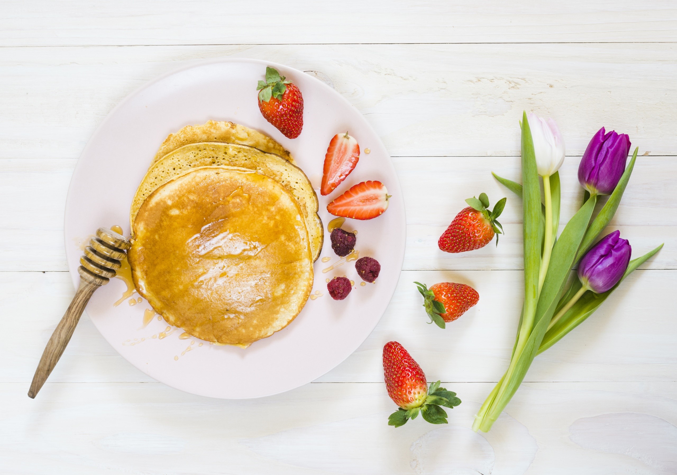 Pancakes with strawberries, raspberries, honey, and tulips HD Wallpaper