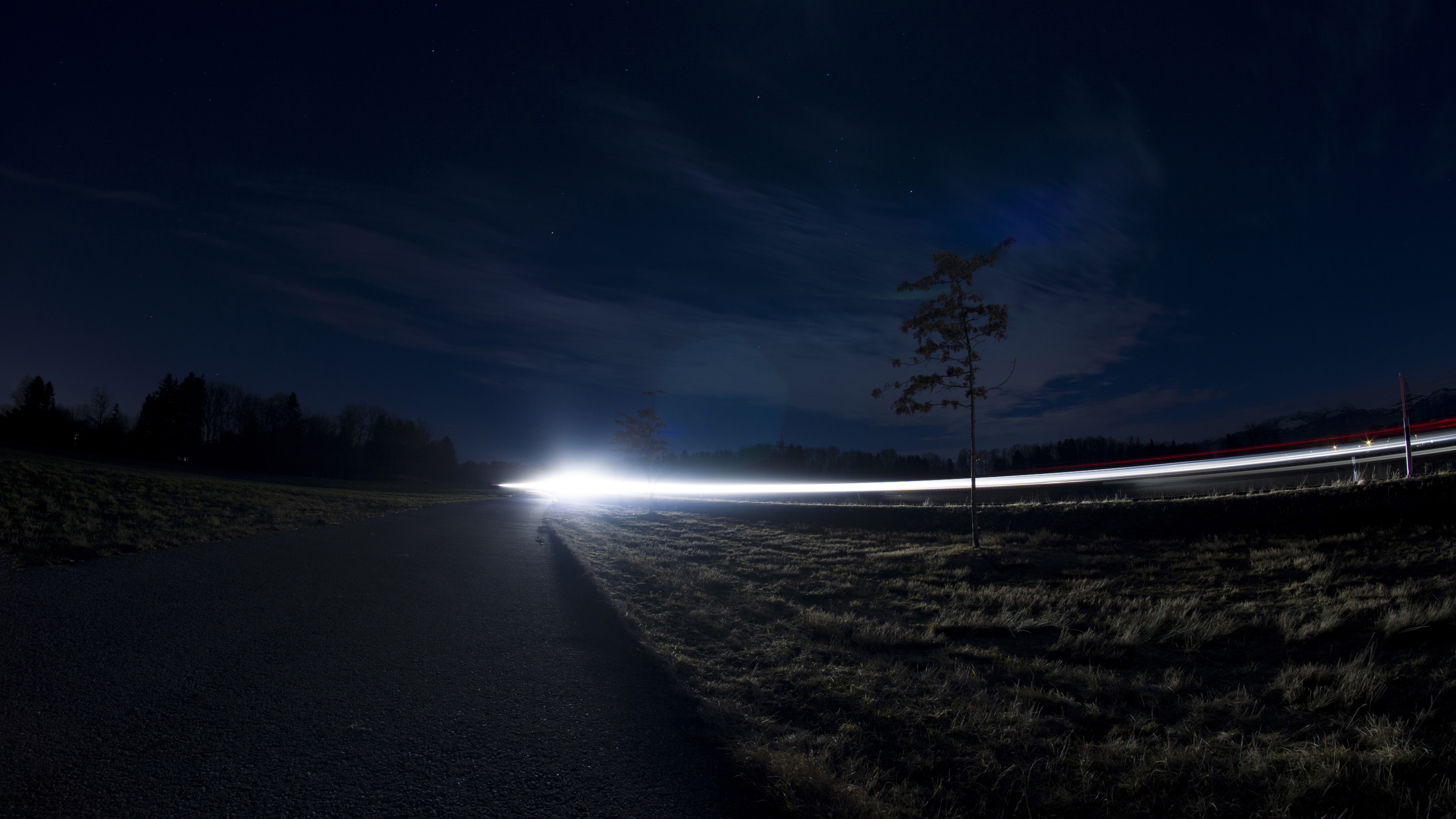 Long exposure of car lights on a road at night HD Wallpaper