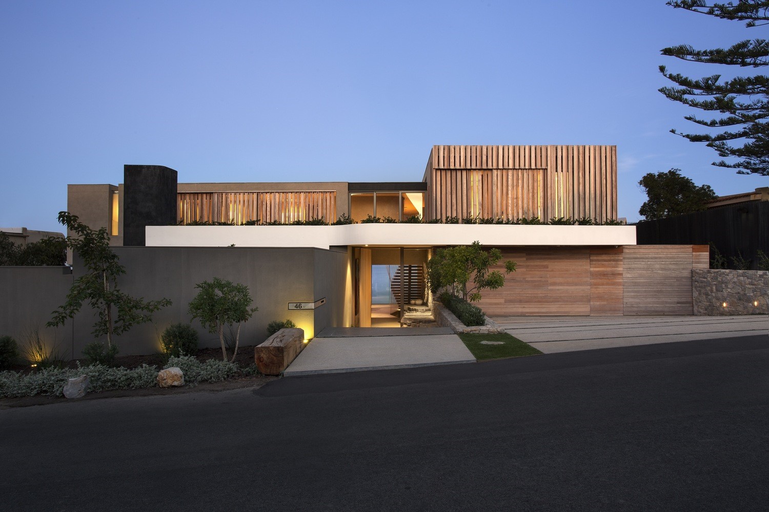 Modern house with wooden facade and concrete walls HD Wallpaper