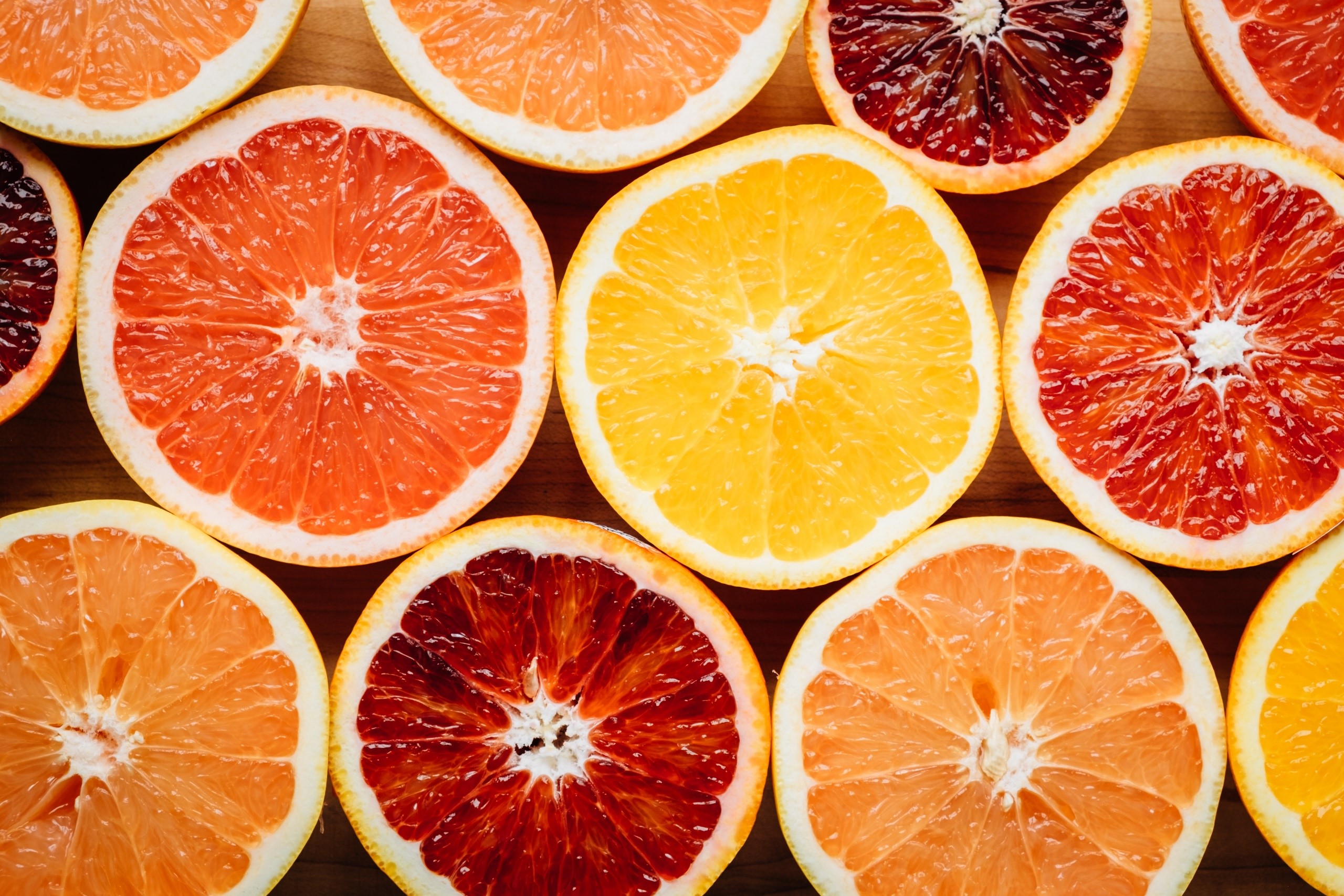 Assortment of sliced citrus fruits HD Wallpaper