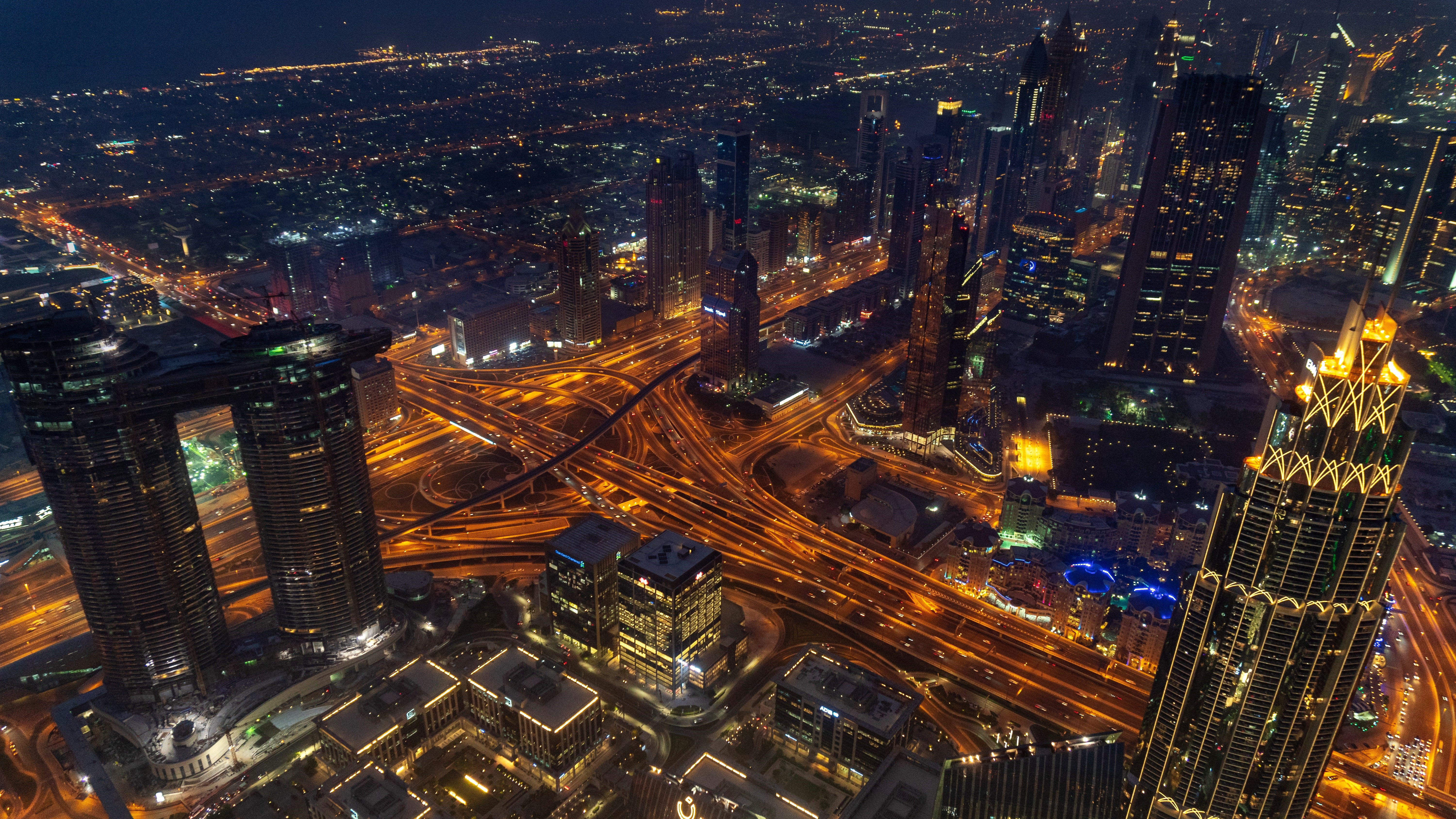 4K Dubai cityscape with traffic at night HD Wallpaper
