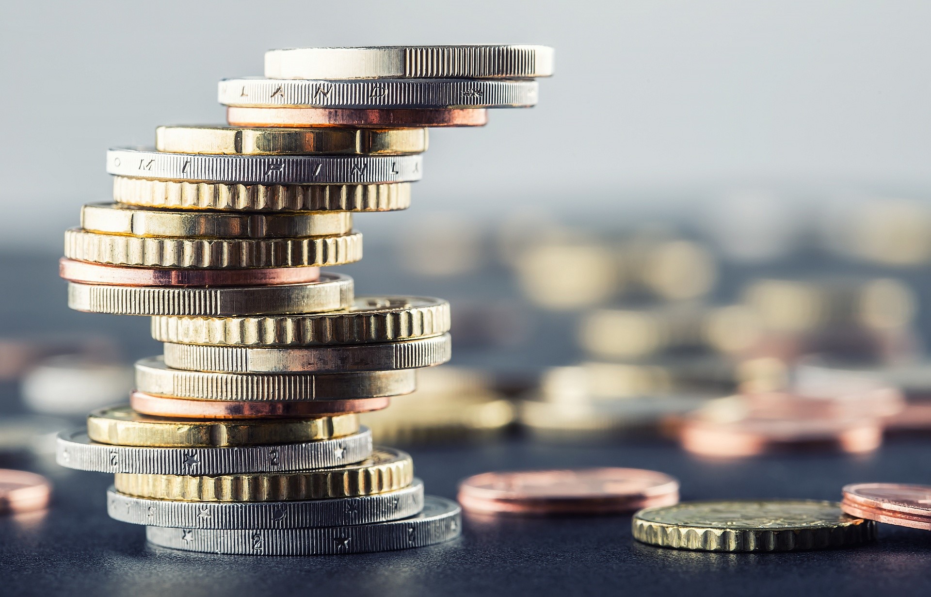 Stack of Euro coins with shallow depth of field HD Wallpaper