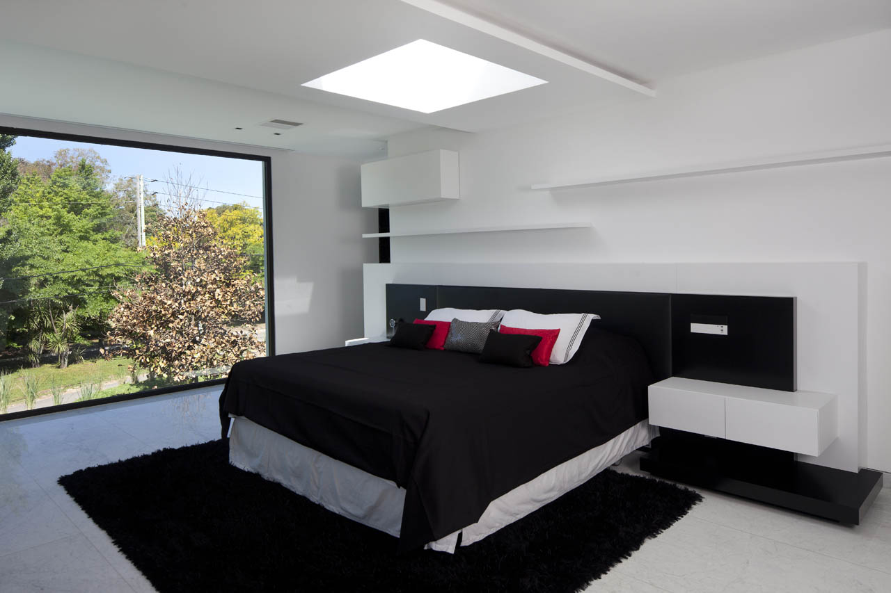 Modern bedroom with large window and black bed HD Wallpaper