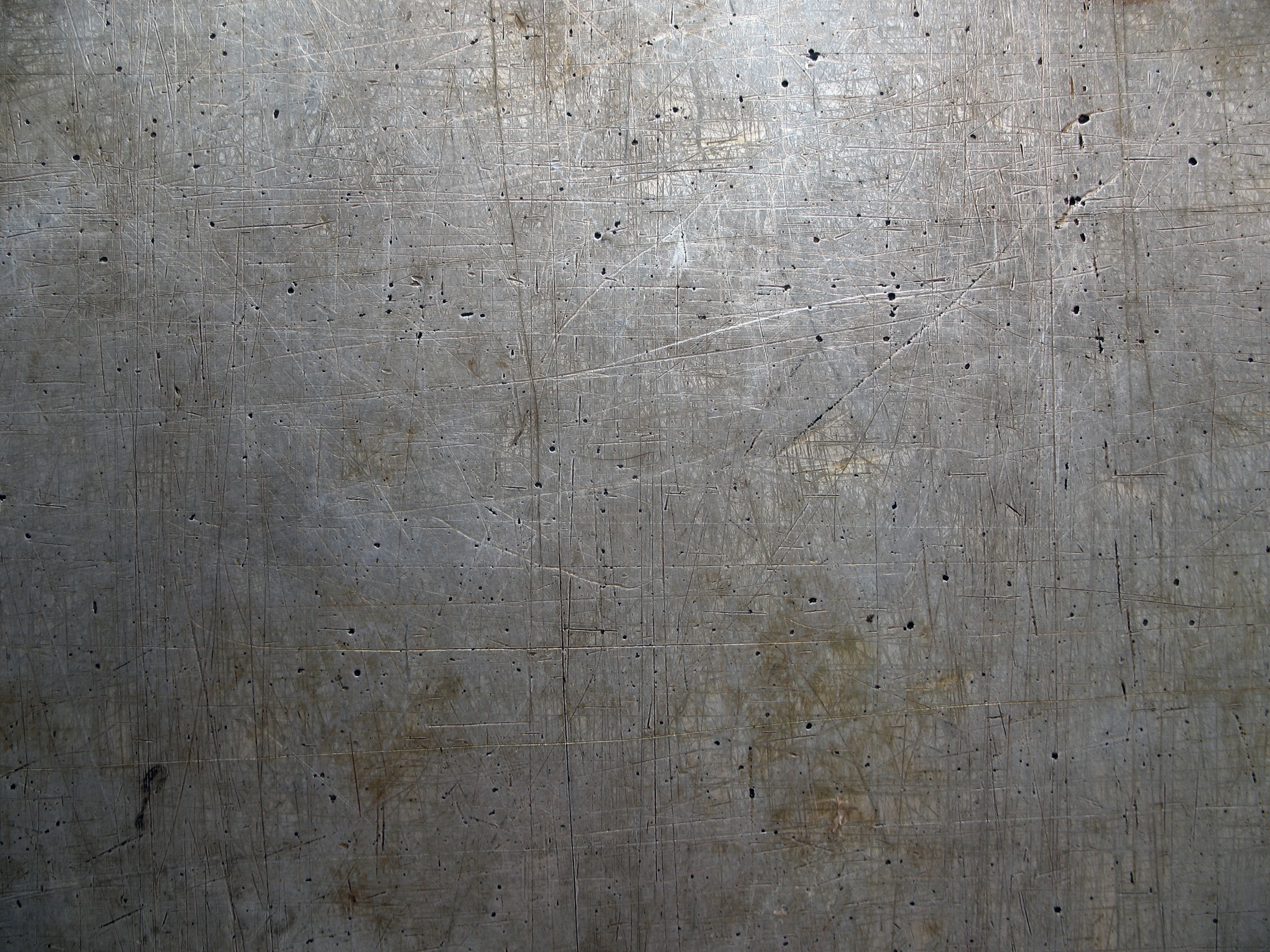 Scratched metal texture with small holes HD Wallpaper