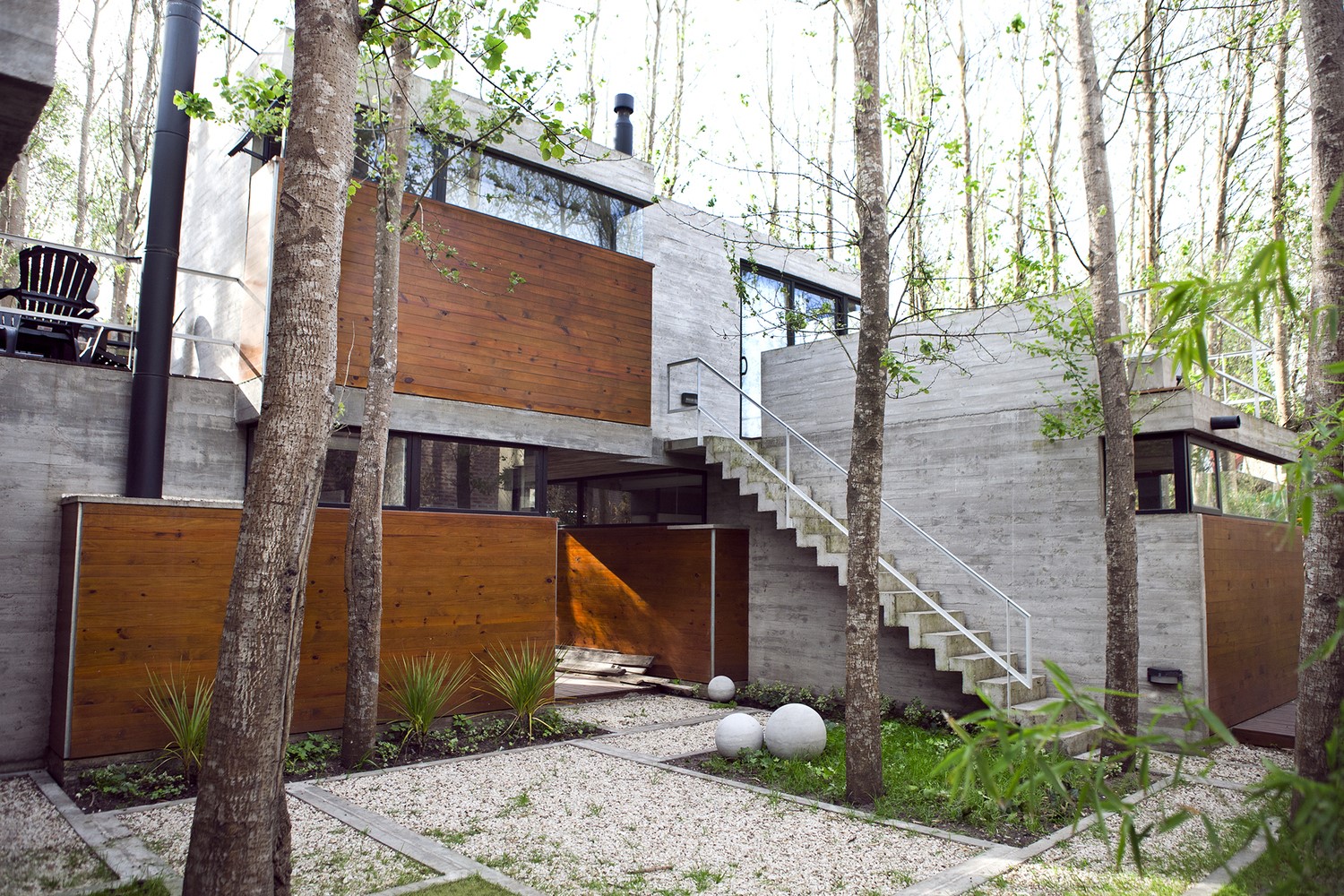 Modern concrete and wood house in a forest HD Wallpaper