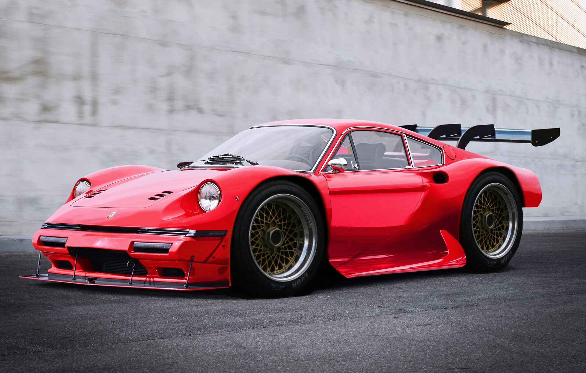 Red Ferrari Dino race car with a large rear spoiler HD Wallpaper