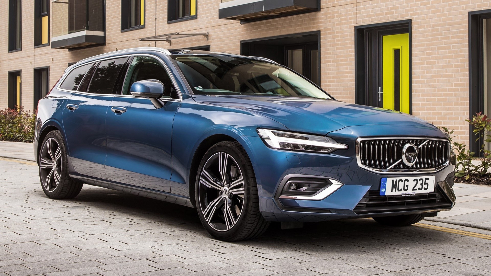 Blue Volvo V60 Estate Car on Pavement HD Wallpaper
