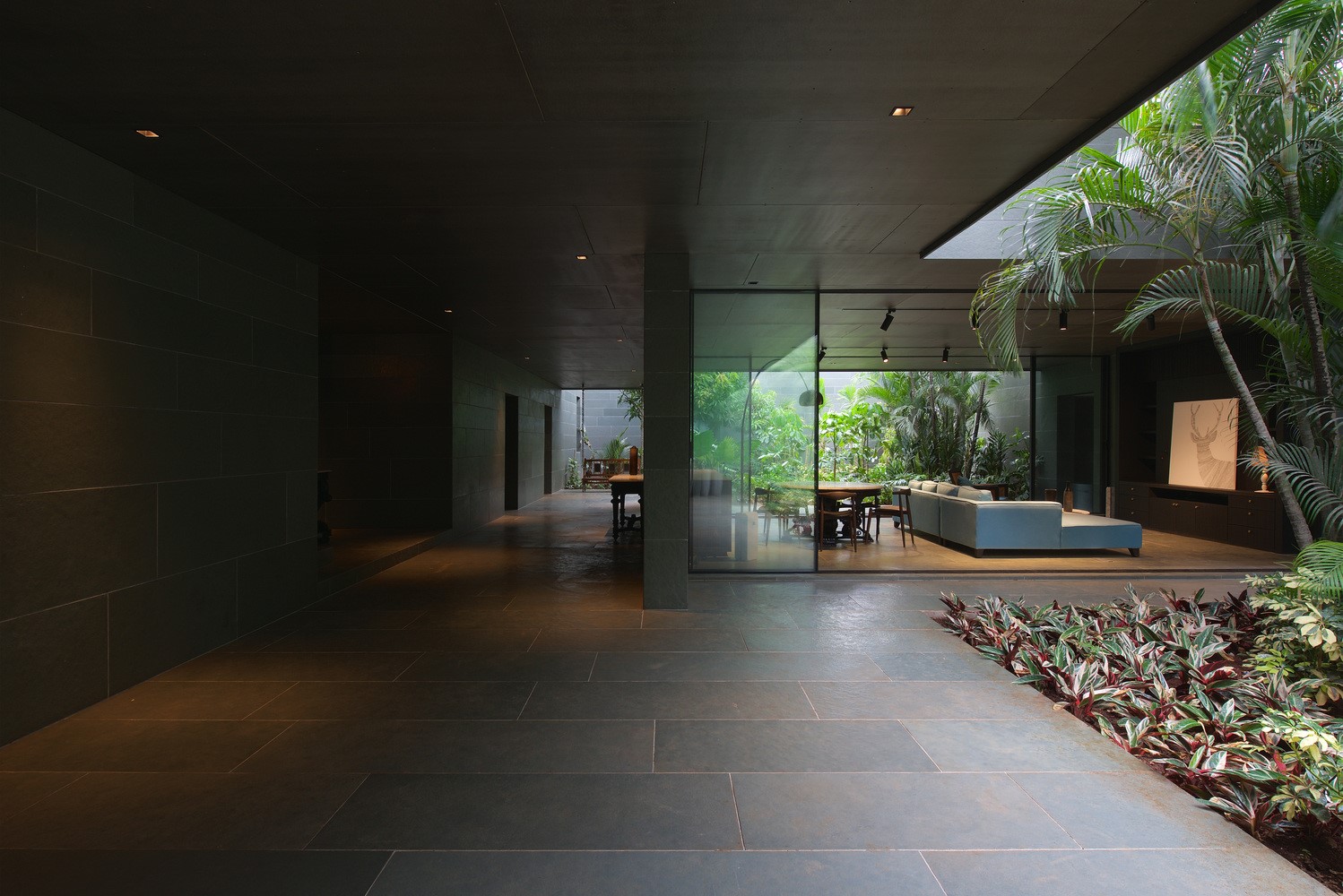 Modern interior with living room and lush greenery HD Wallpaper