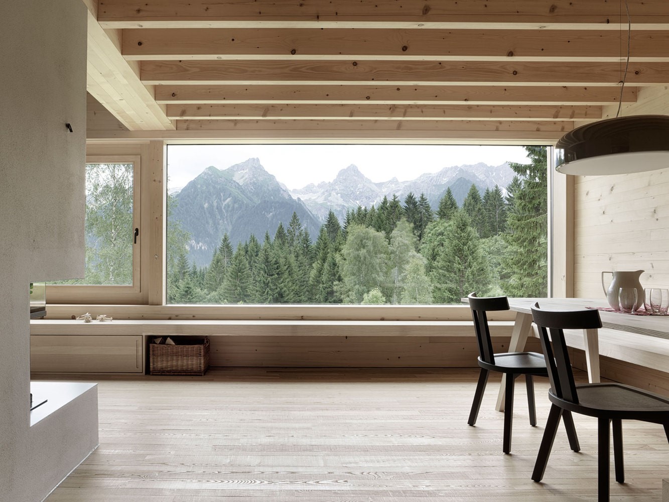 Interior with large window overlooking mountains and forest HD Wallpaper