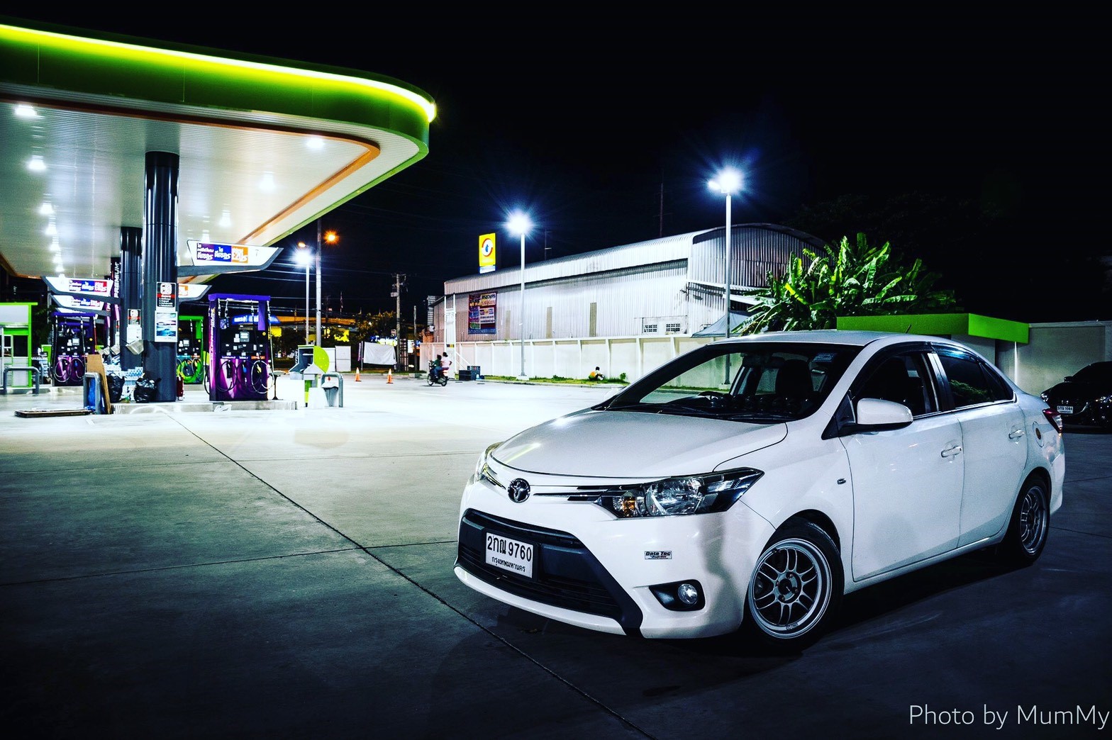 White Toyota Vios at a gas station at night HD Wallpaper