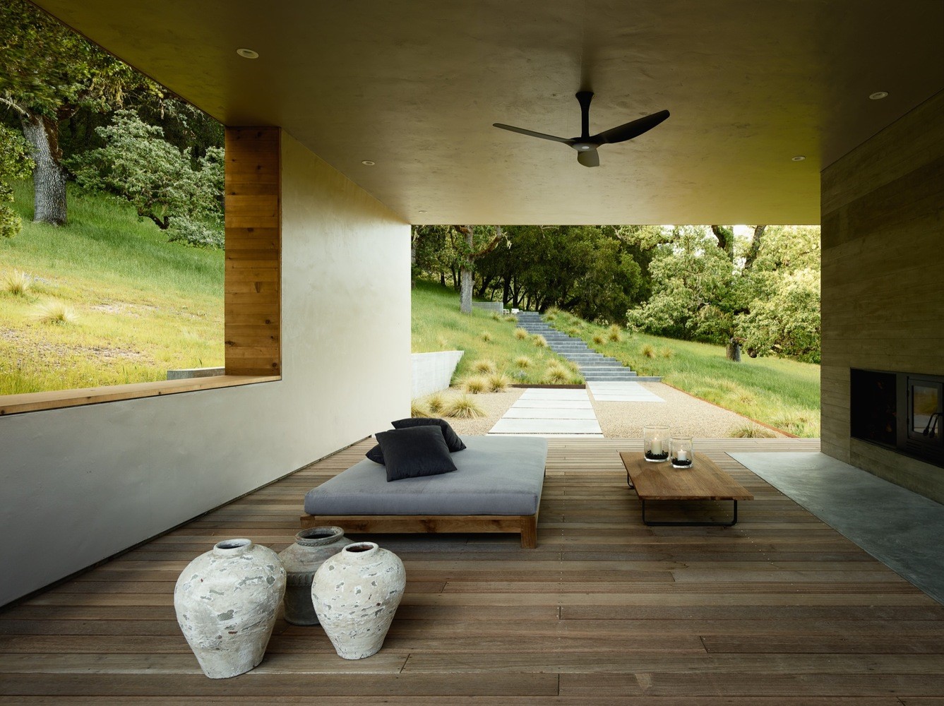 Modern outdoor living space with fireplace and view HD Wallpaper