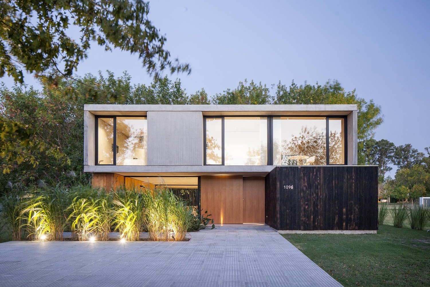 Modern concrete and wood house with large windows HD Wallpaper