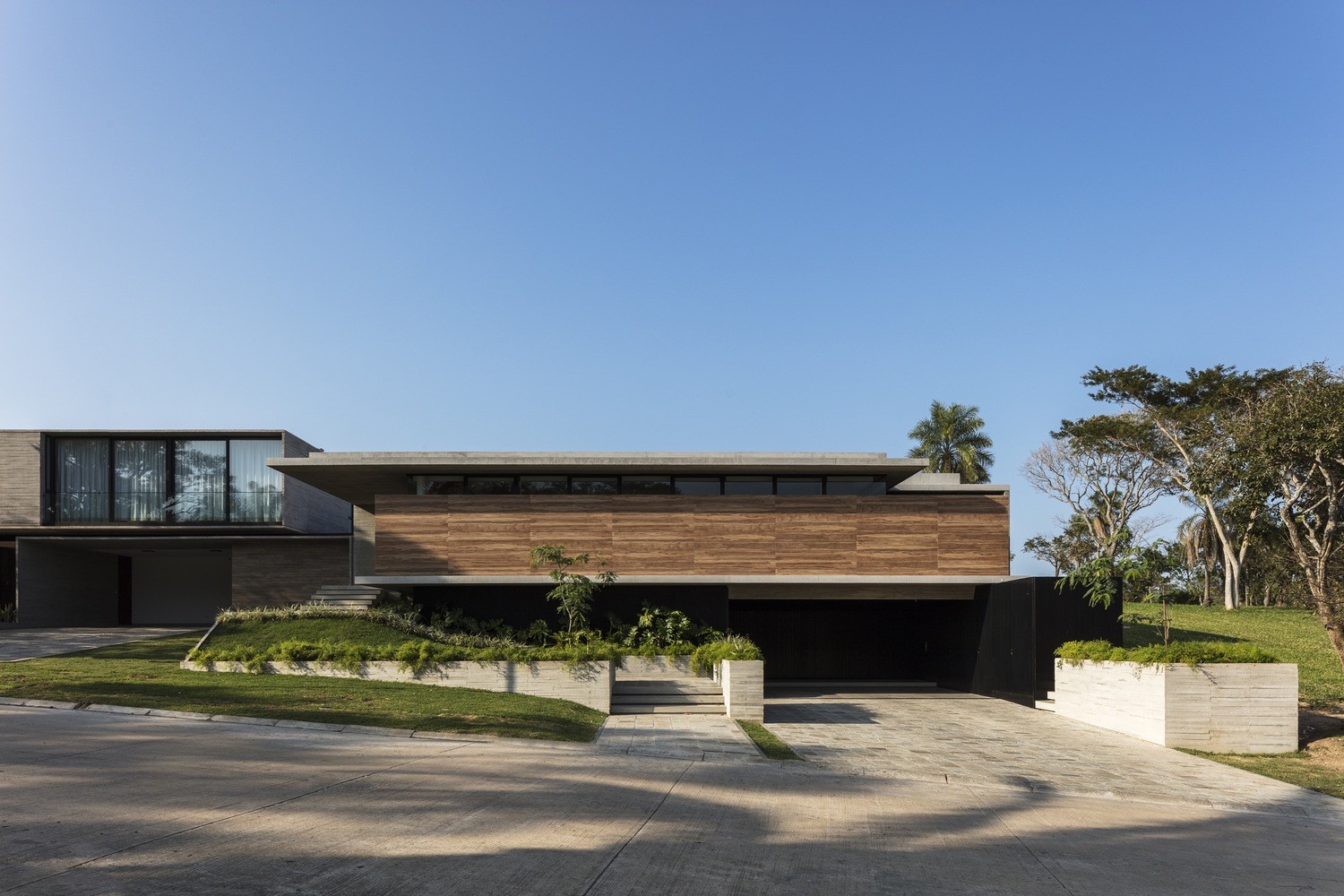 Modern house with wooden facade and concrete elements HD Wallpaper
