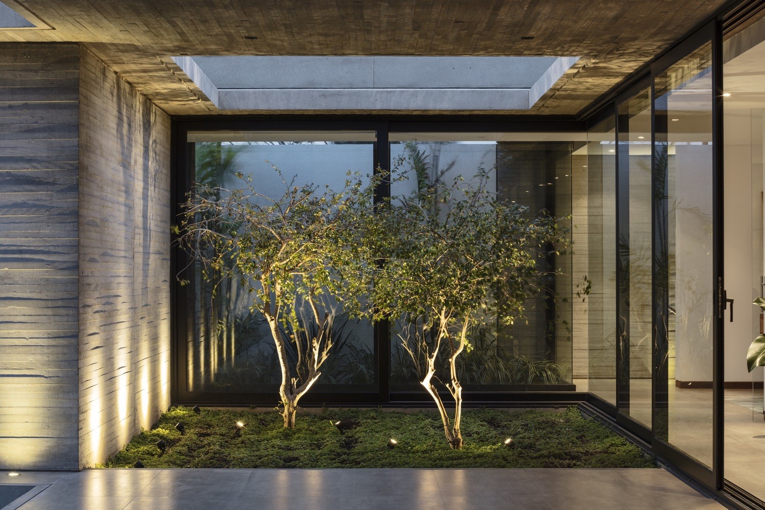 Modern courtyard with trees and concrete walls HD Wallpaper