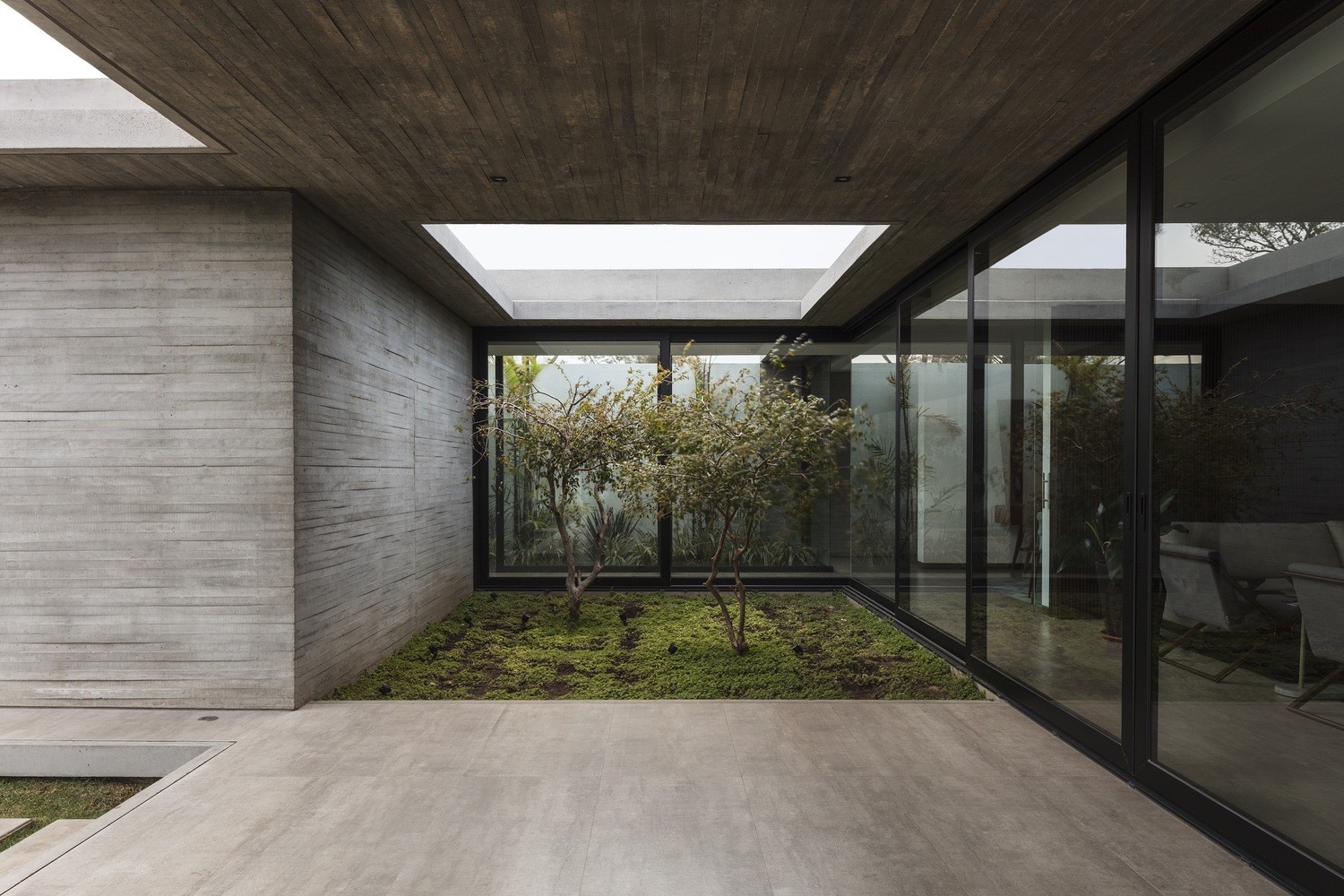 Modern concrete courtyard with indoor garden HD Wallpaper