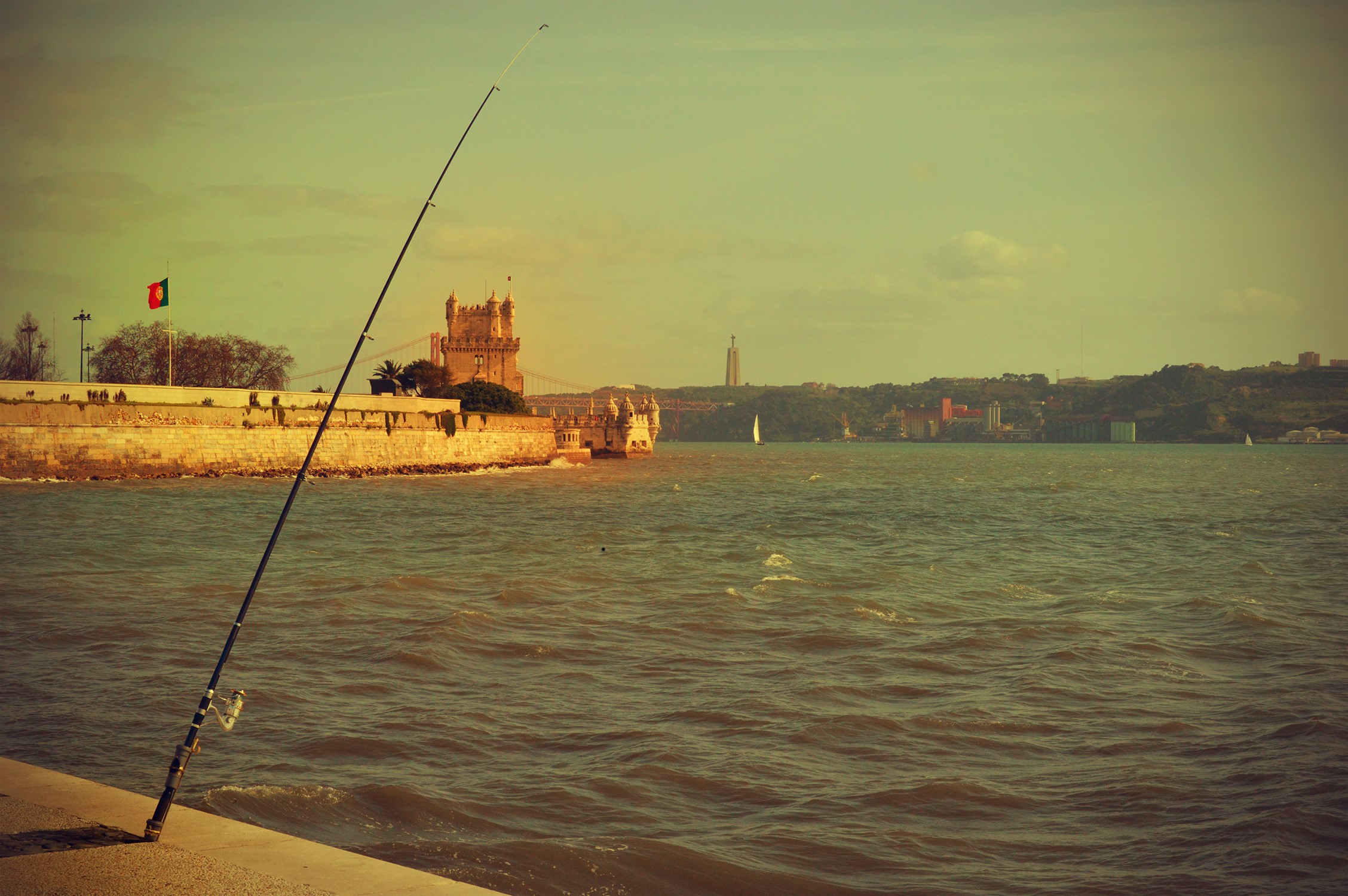 Fishing rod on the Tagus River in Lisbon, Portugal HD Wallpaper