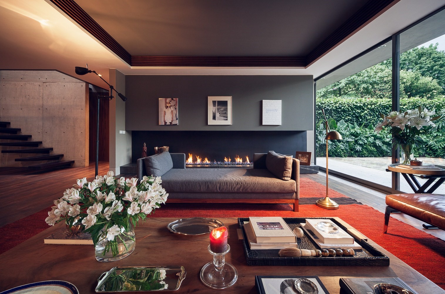 Modern living room with fireplace and large window HD Wallpaper