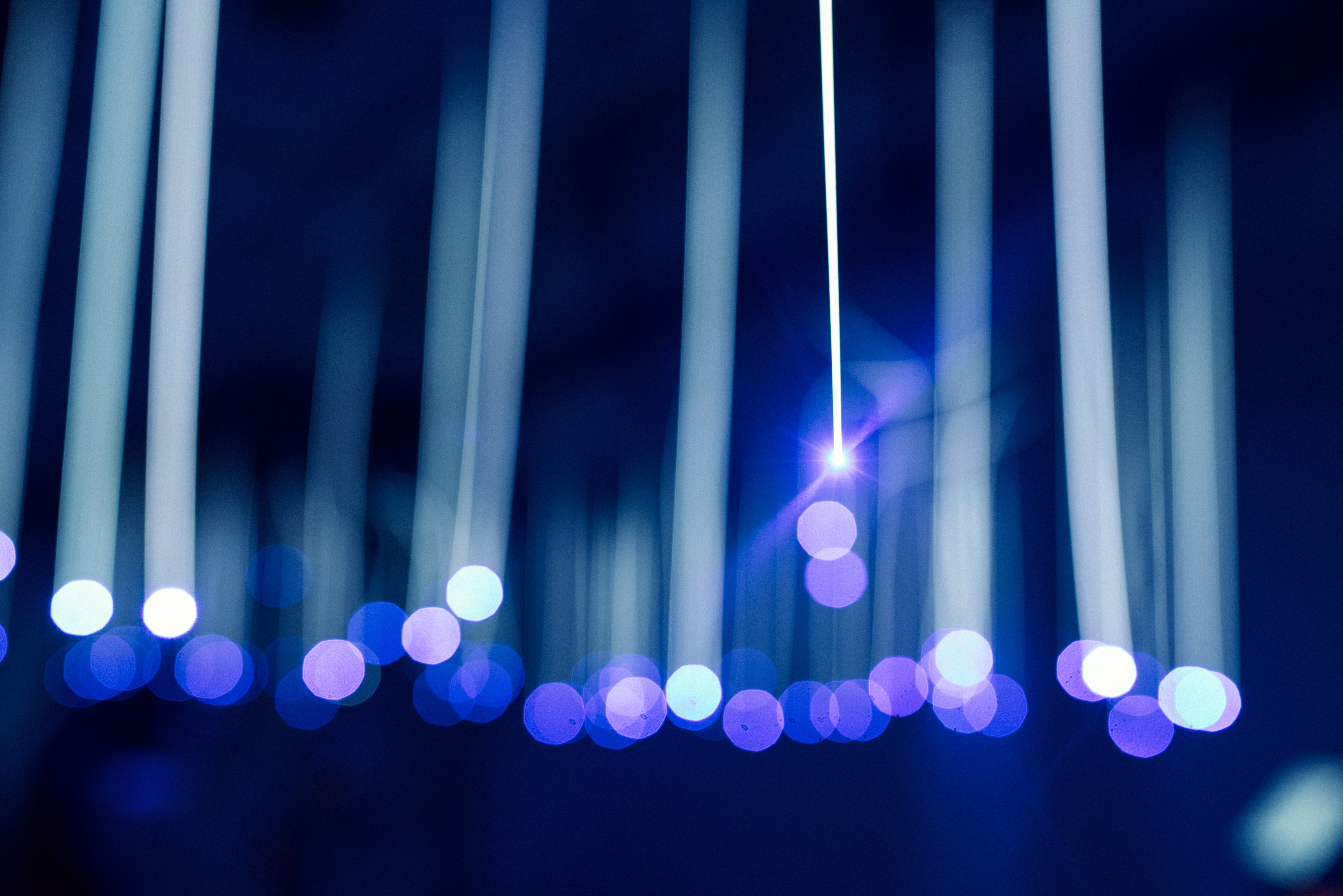 Blue bokeh and light beams HD Wallpaper