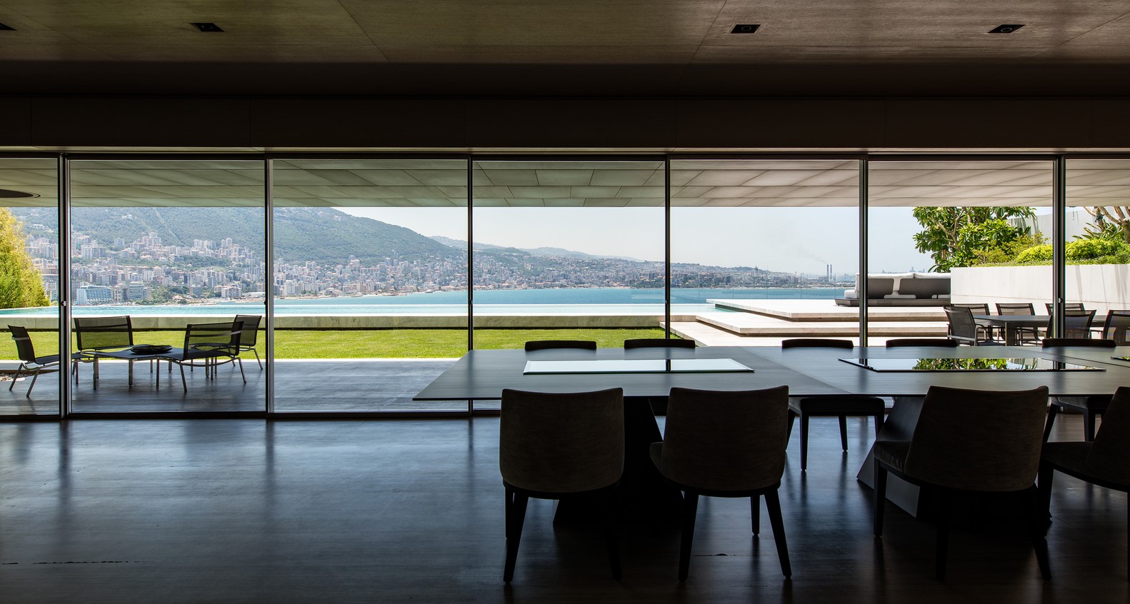 Modern dining room with panoramic ocean view HD Wallpaper