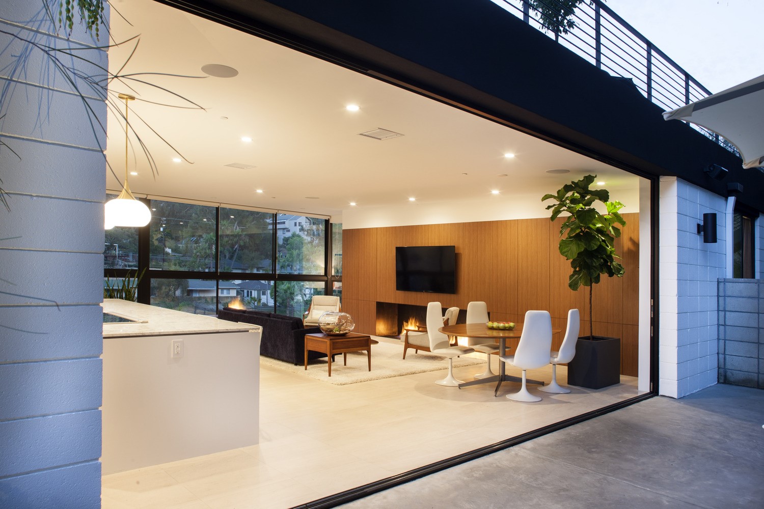 Modern living room with fireplace and dining area HD Wallpaper