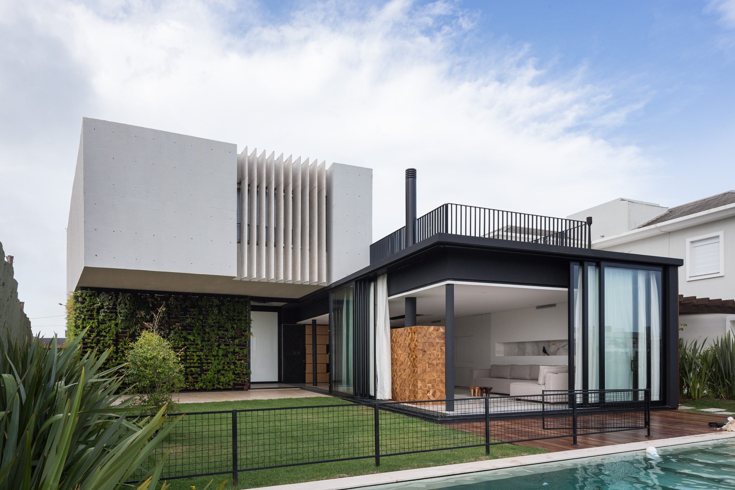 Modern house with vertical garden and swimming pool HD Wallpaper