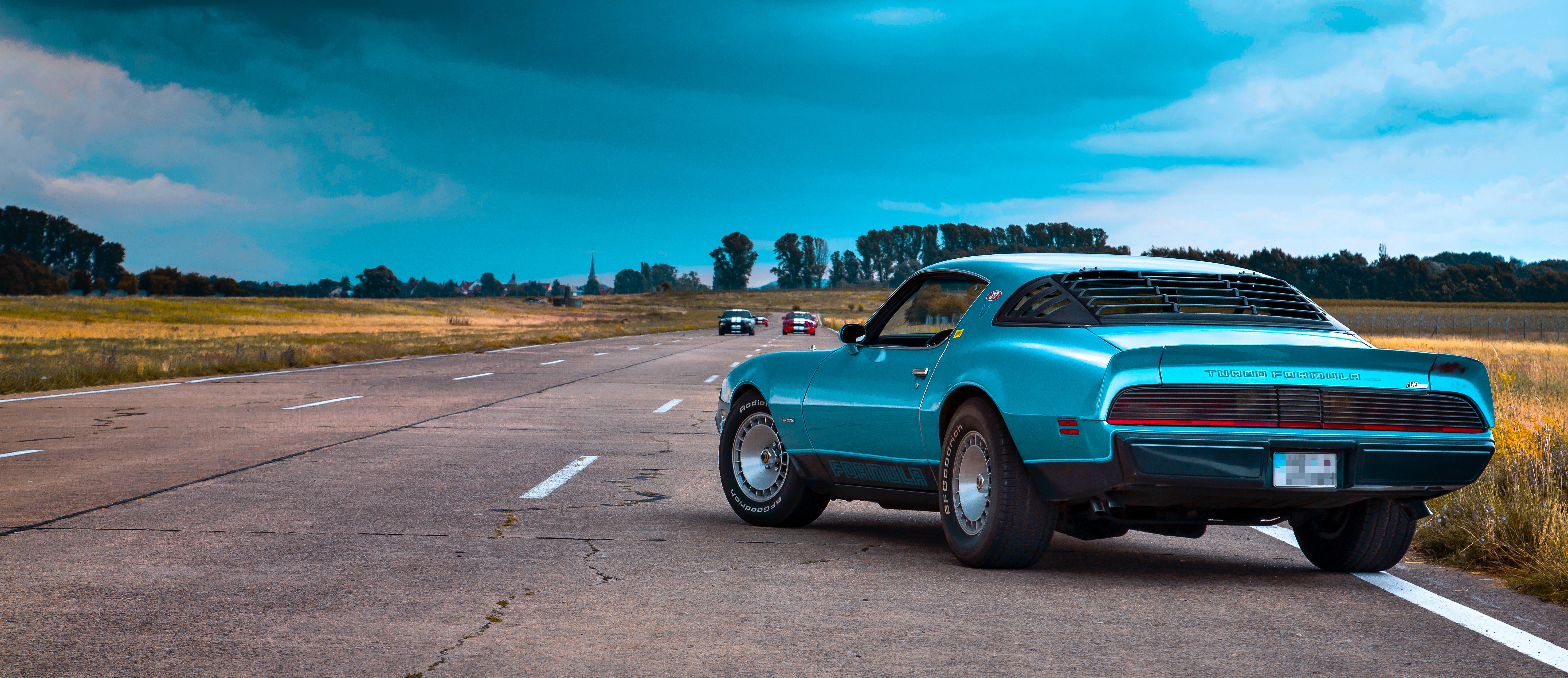 Blue Pontiac Firebird Trans Am on a Road HD Wallpaper