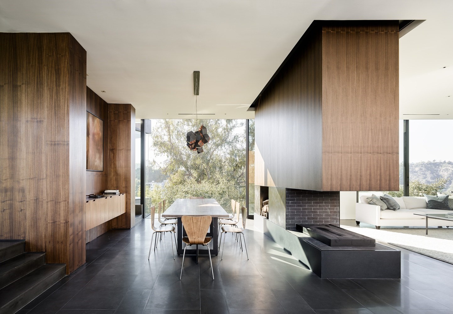 Modern dining room with large windows and fireplace HD Wallpaper