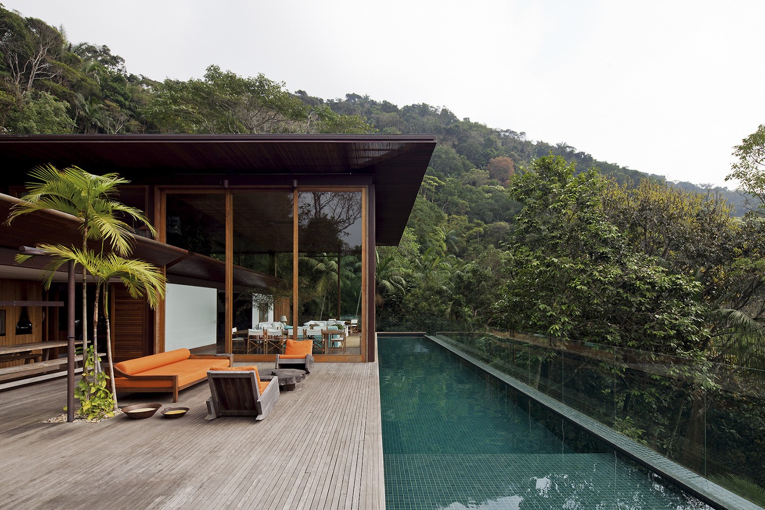 Modern house with swimming pool and jungle view HD Wallpaper
