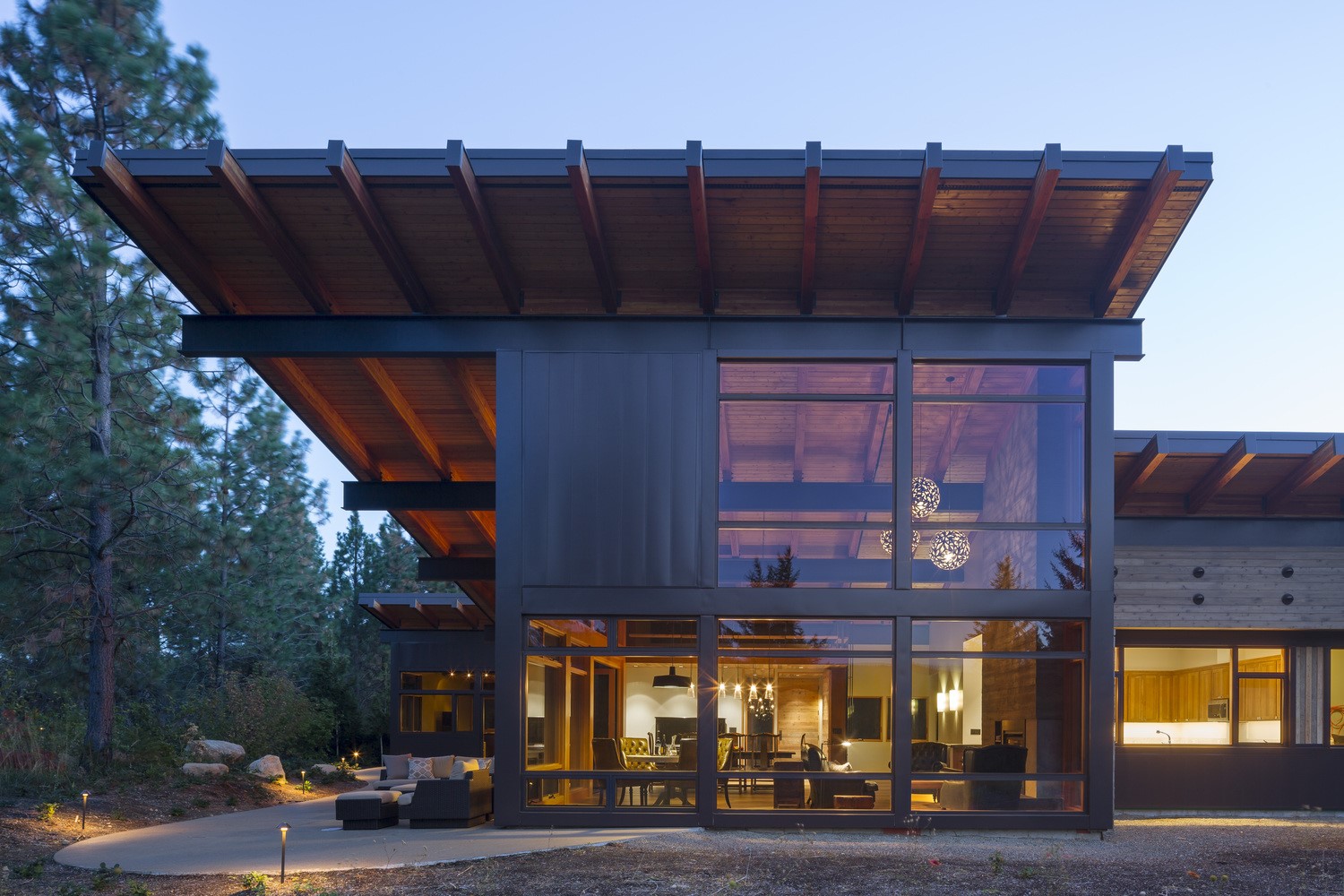 Modern house with large windows and wooden roof HD Wallpaper