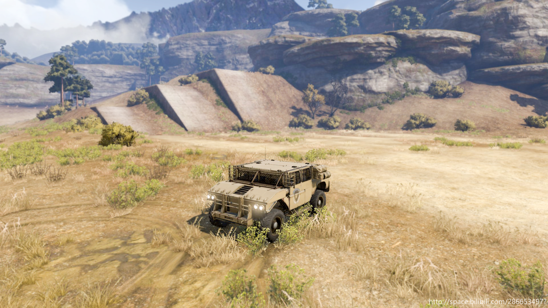 Military vehicle in a dry, hilly landscape HD Wallpaper