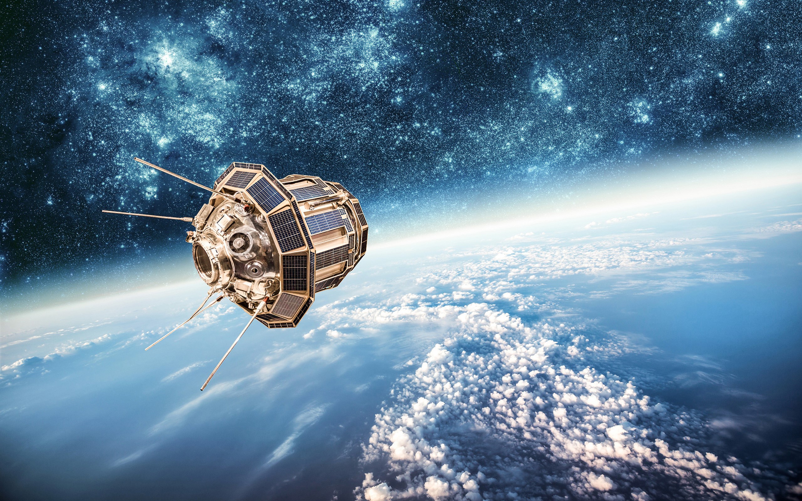 Satellite orbiting Earth with stars in the background HD Wallpaper