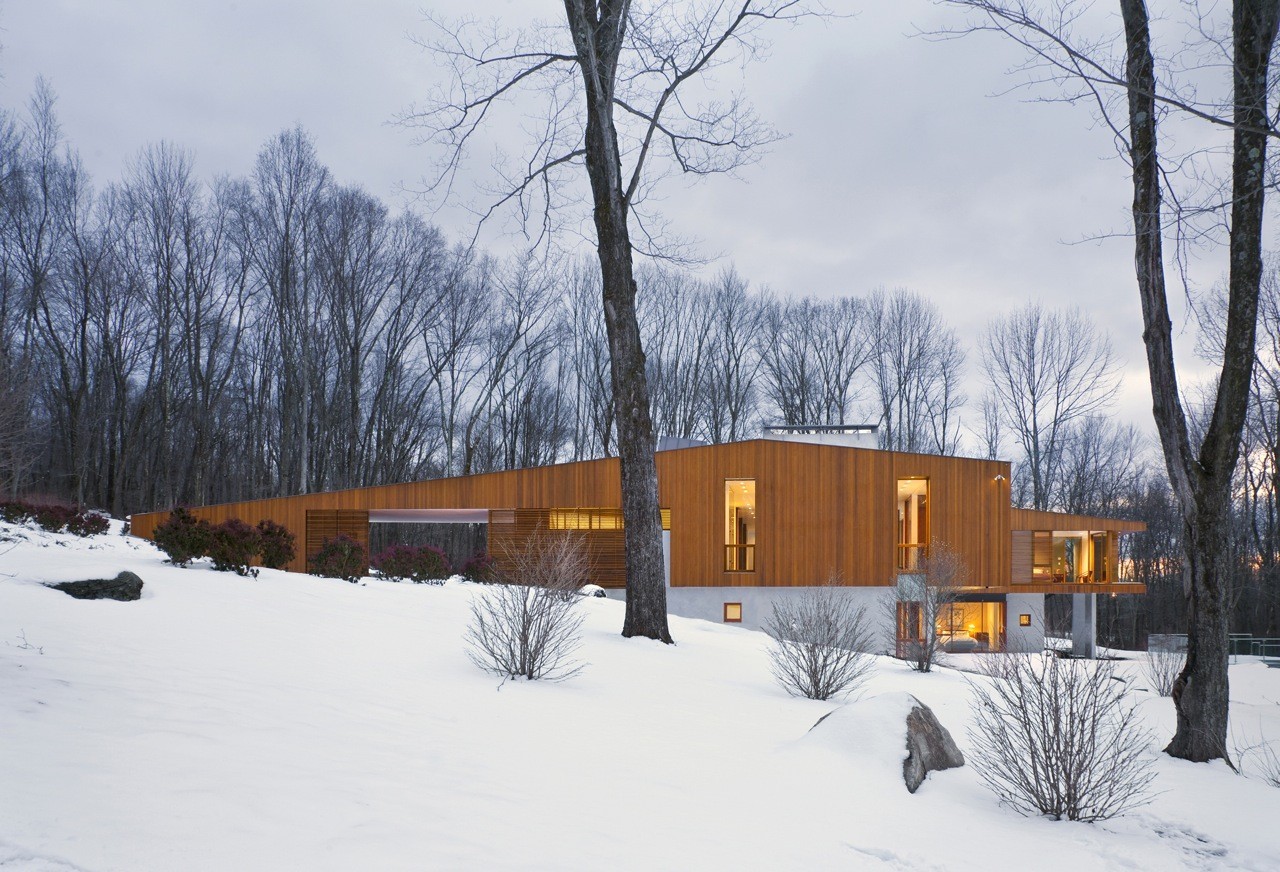 Modern wooden house in winter landscape HD Wallpaper