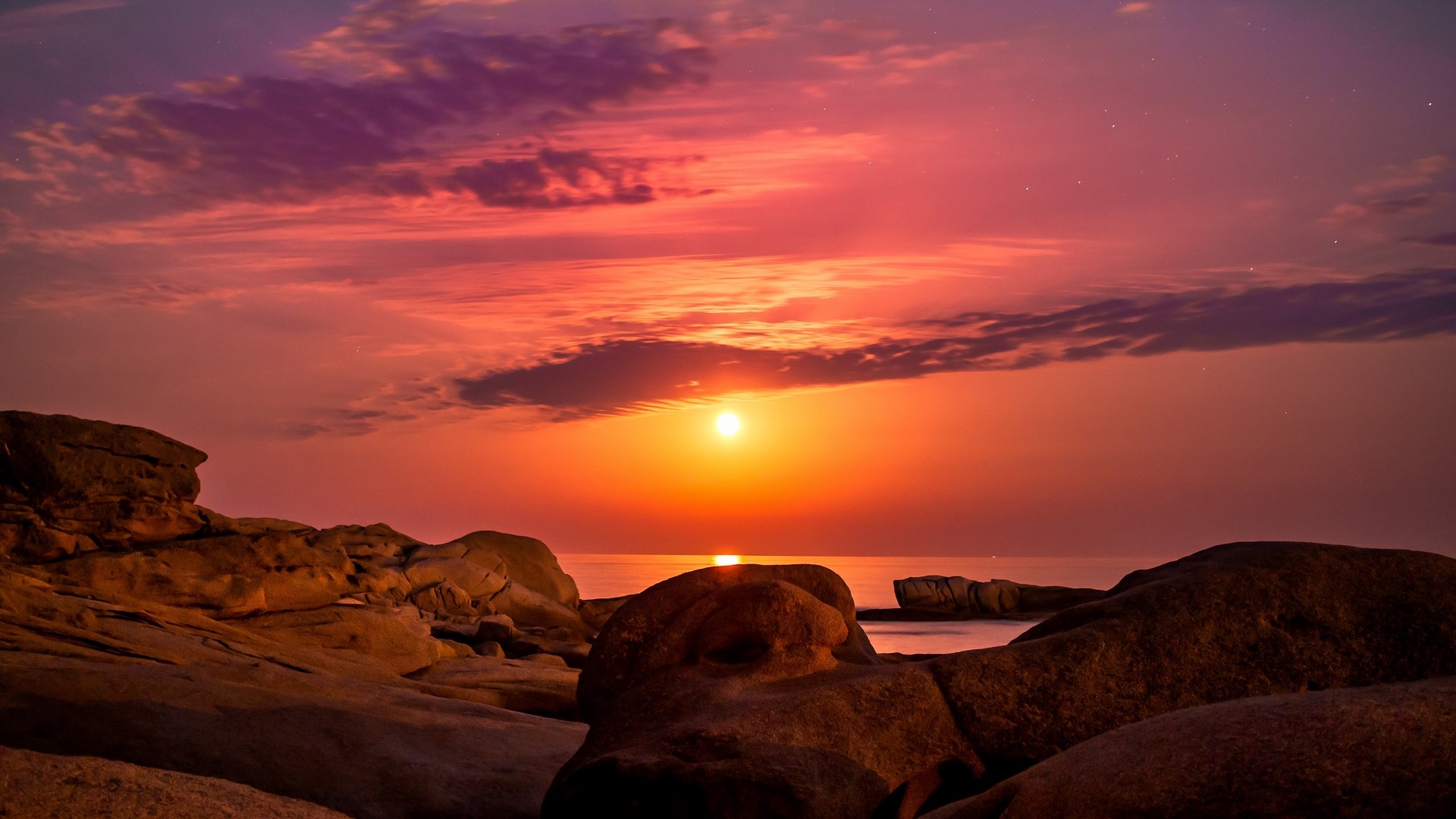 Sunset over the sea with rocks HD Wallpaper