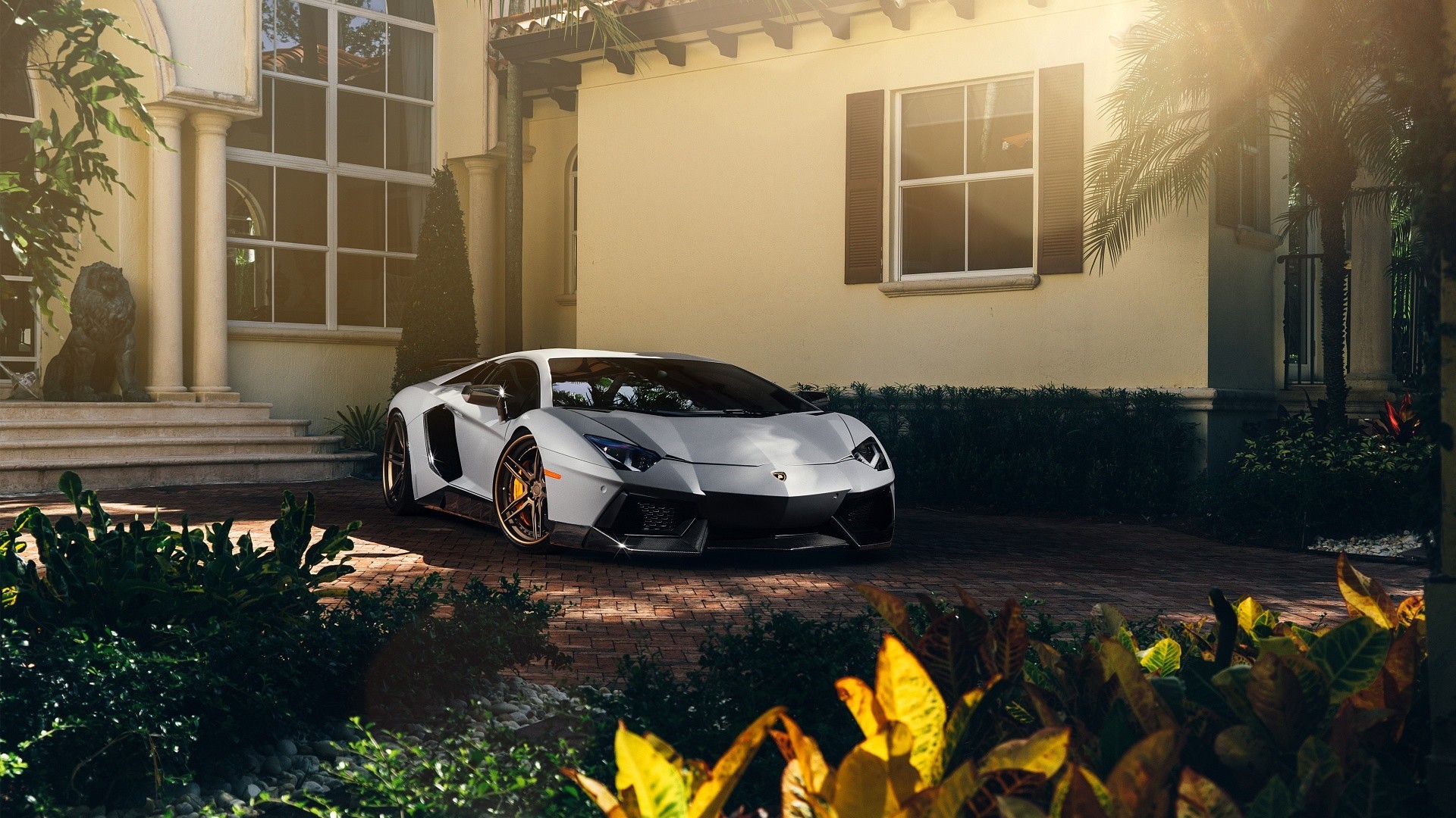 White Lamborghini Aventador parked in front of a mansion HD Wallpaper