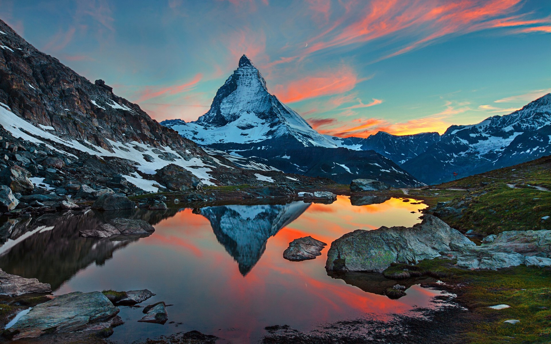 Matterhorn mountain reflected in a lake at sunset HD Wallpaper