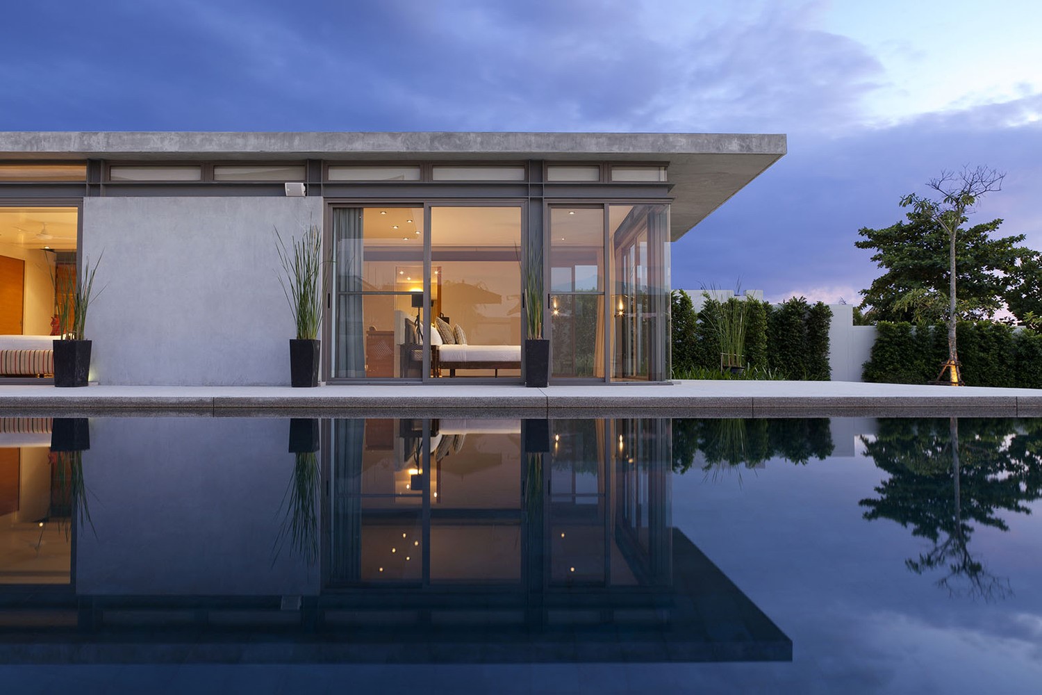 Modern house with swimming pool at dusk HD Wallpaper