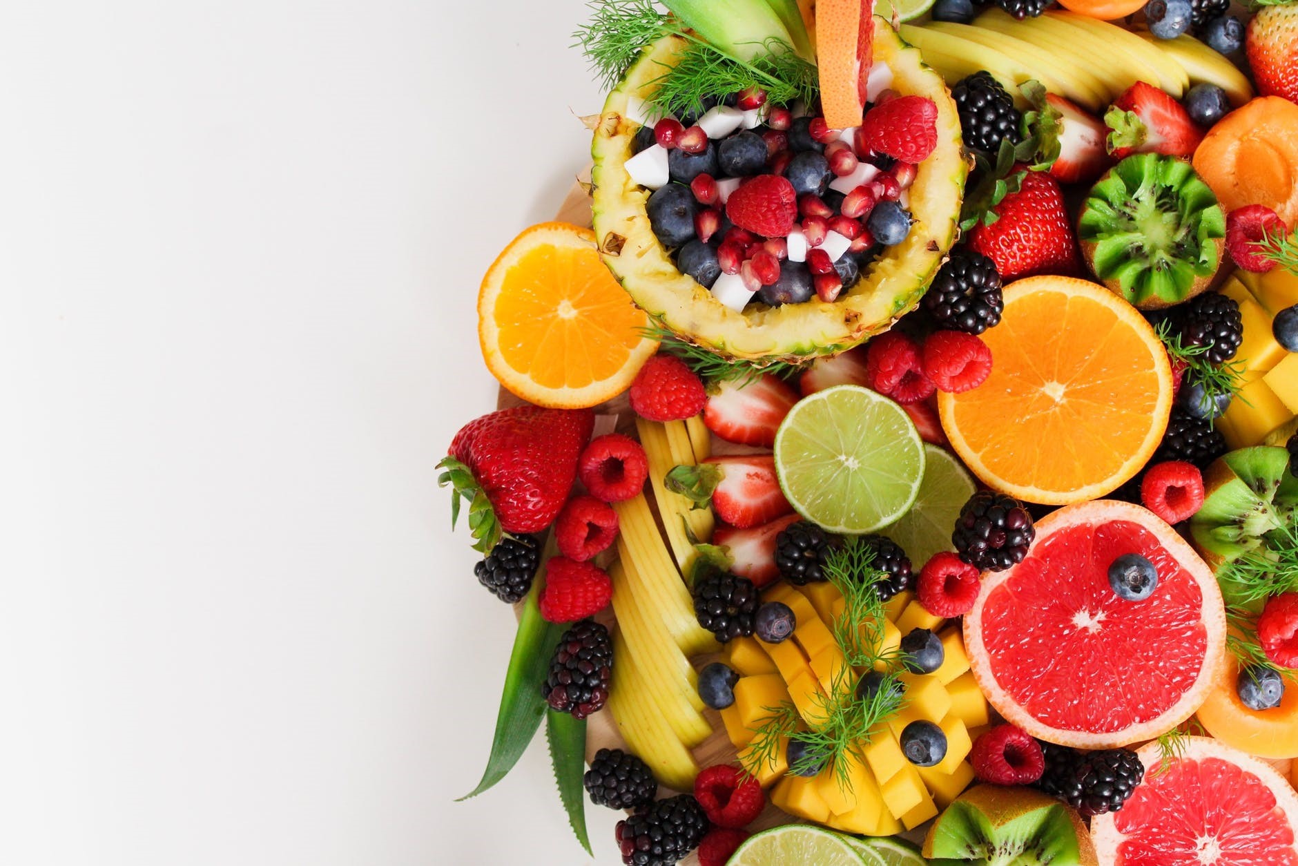 Assortment of fresh fruits on a platter HD Wallpaper