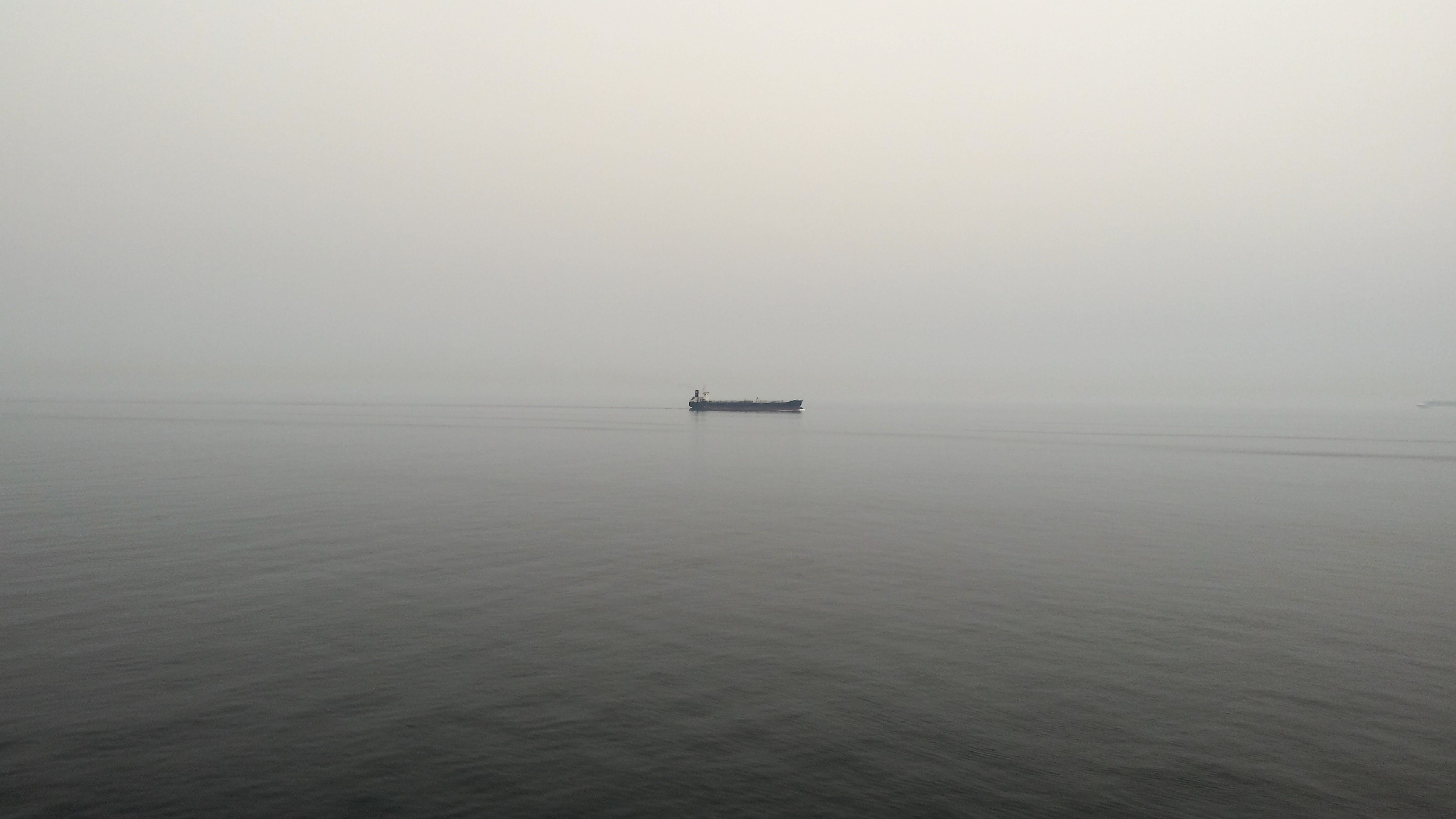 Ship in the mist on the sea HD Wallpaper
