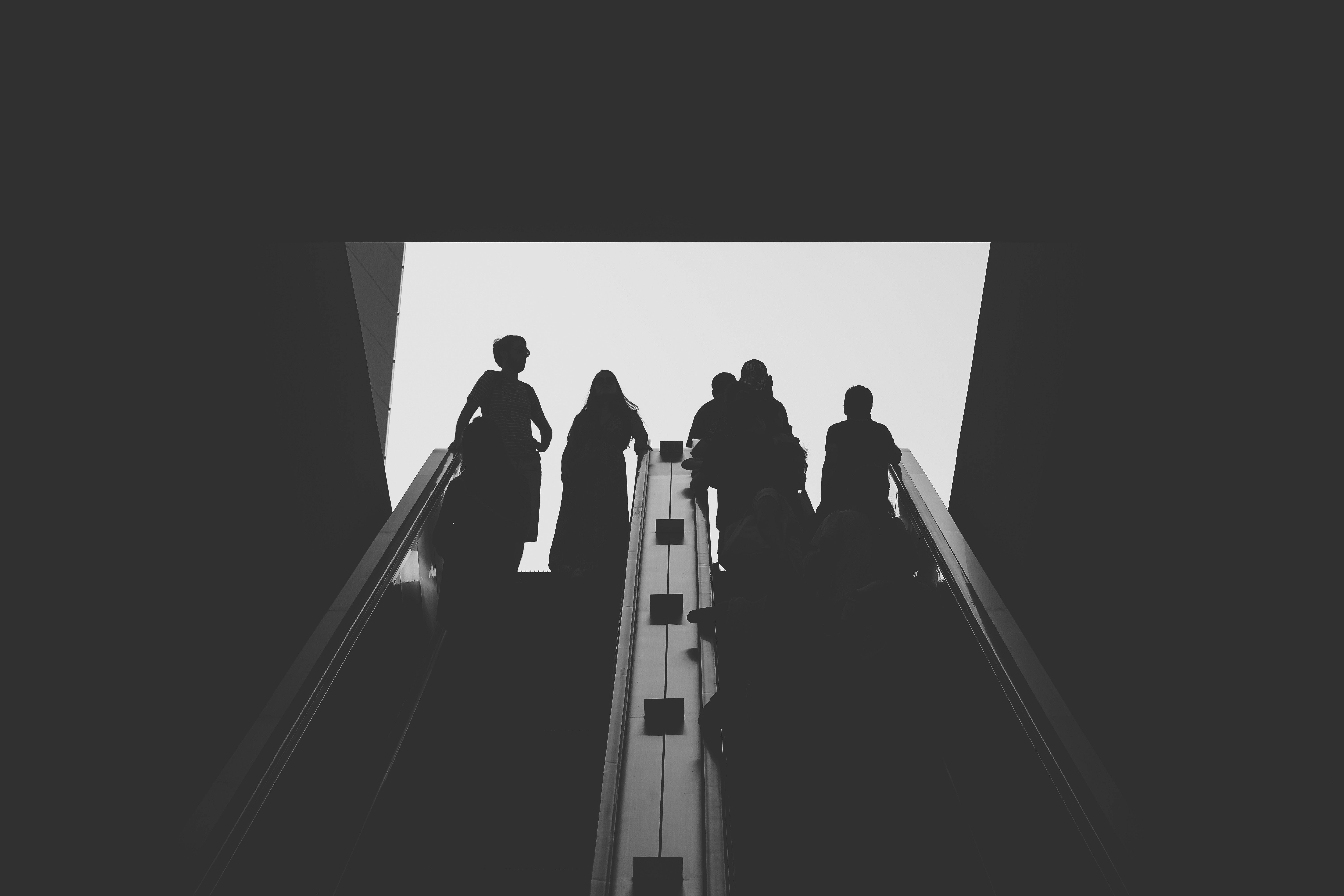 Monochrome photography of people on an escalator HD Wallpaper