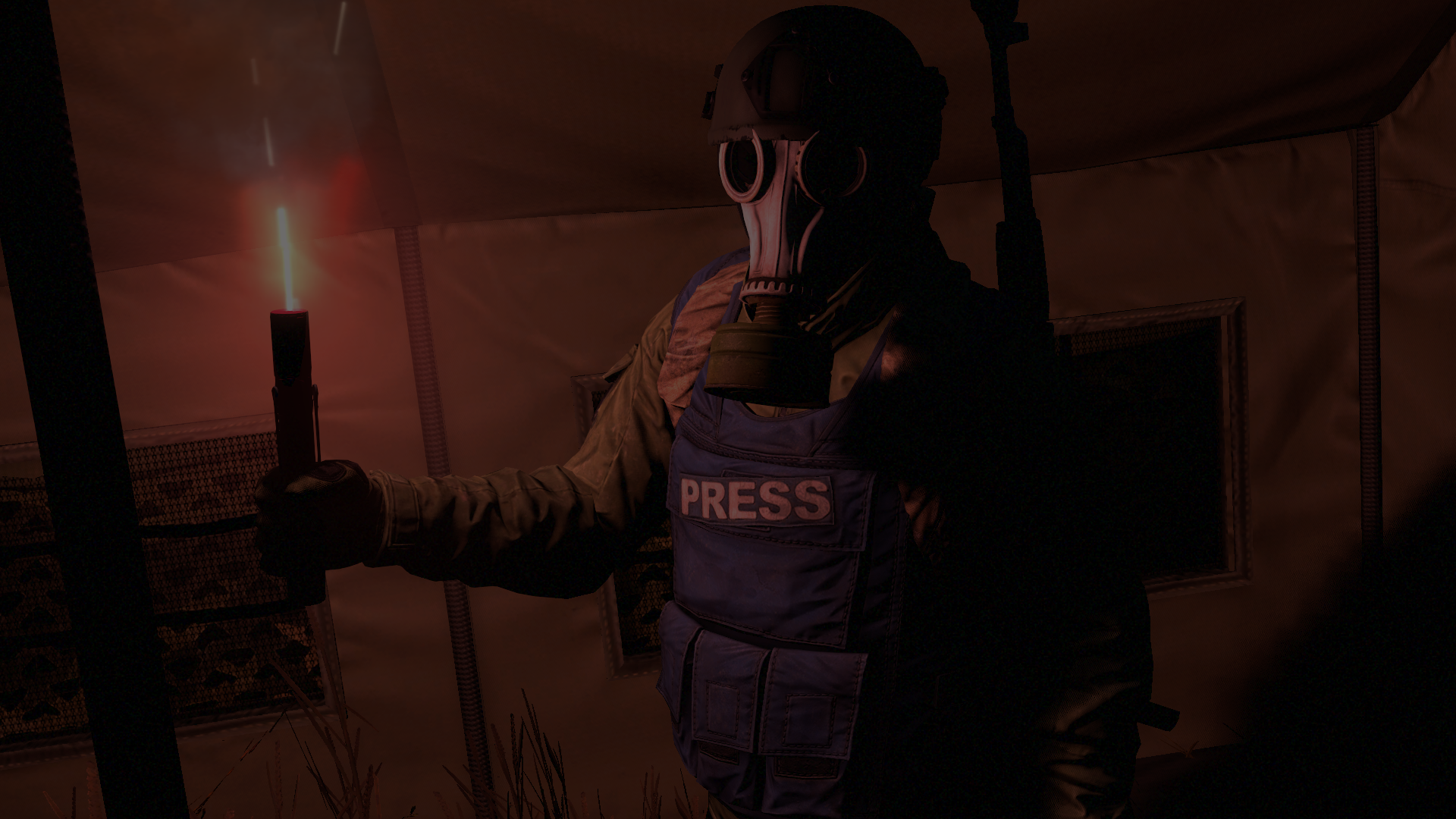 Press member in gas mask holding flare in tent HD Wallpaper